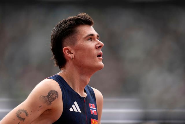 <p>Norway's Jakob Ingebrigtsen reacts after finishing a men's 1,500 meters heat at the World Athletics Championships</p>