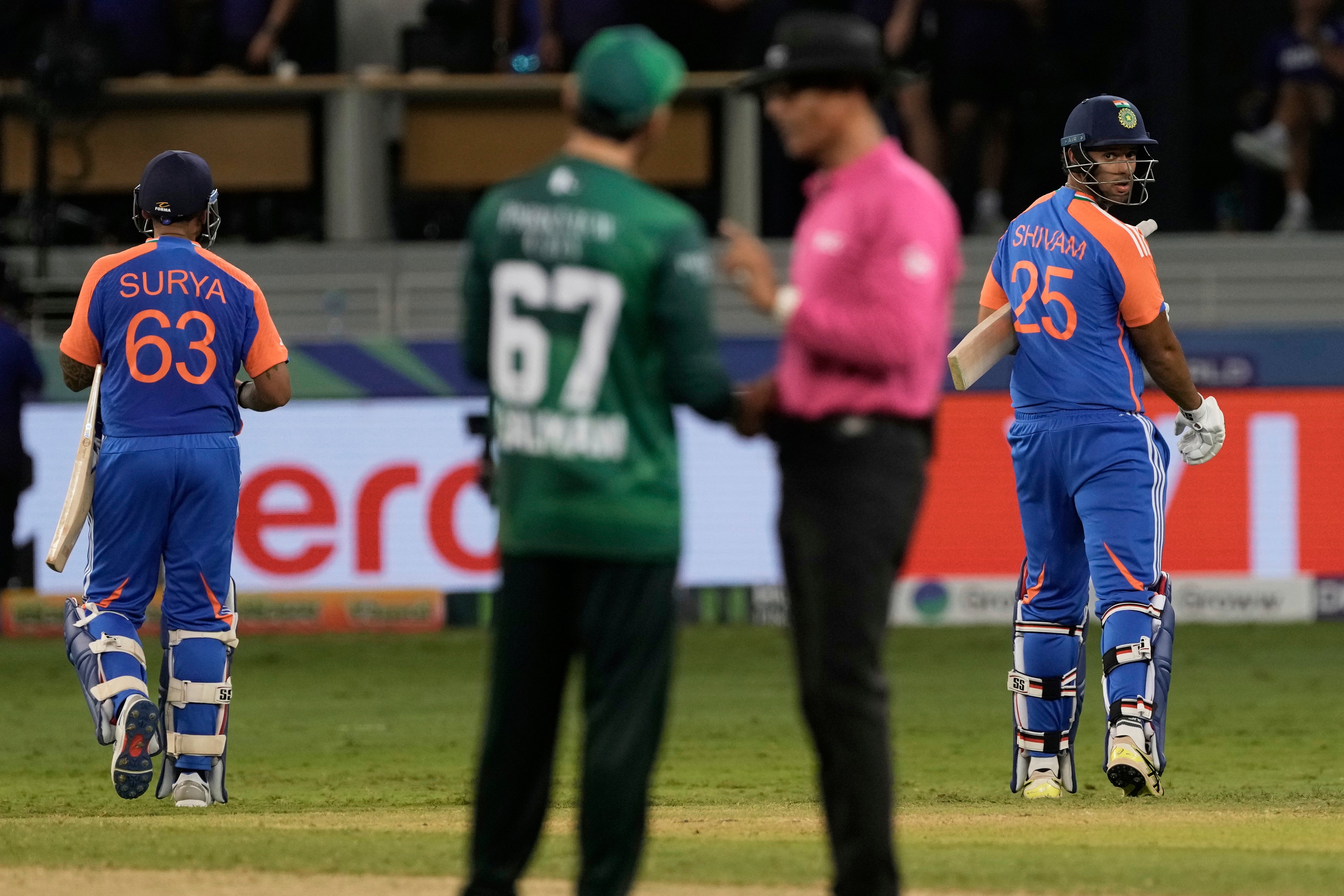 India’s captain Suryakumar Yadav, left, and batting partner Shivam Dube, right, leave the field after their win in the Asia Cup cricket match against Pakistan at Dubai International Cricket Stadium in Dubai, United Arab Emirates, Sunday, 14 September 2025