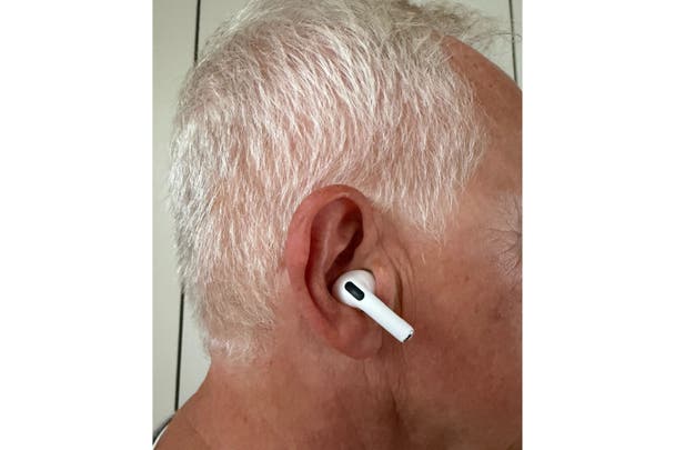 David wearing the AirPods Pro 3