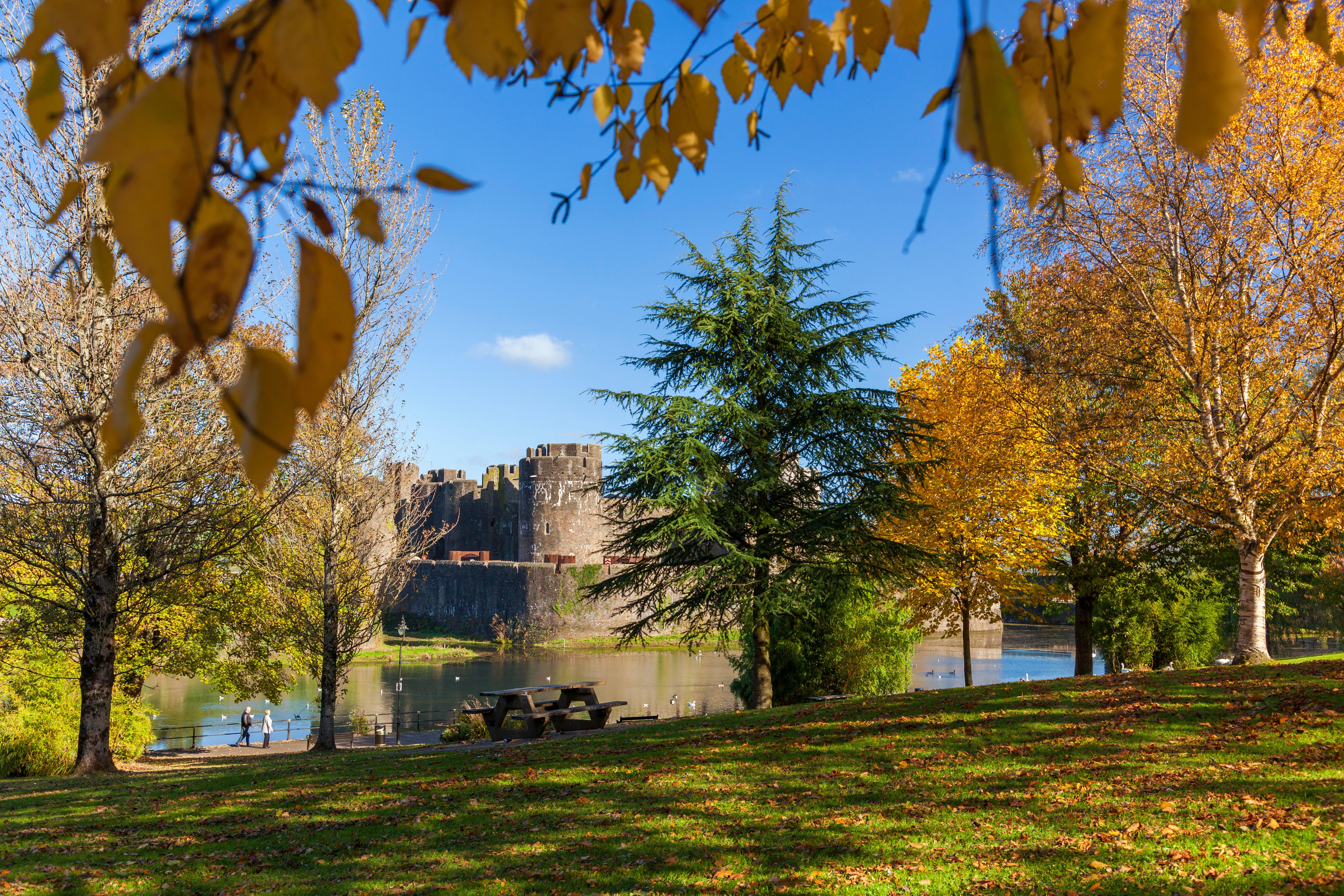 Autumn colours frame Caerphilly Castle in Cardiff