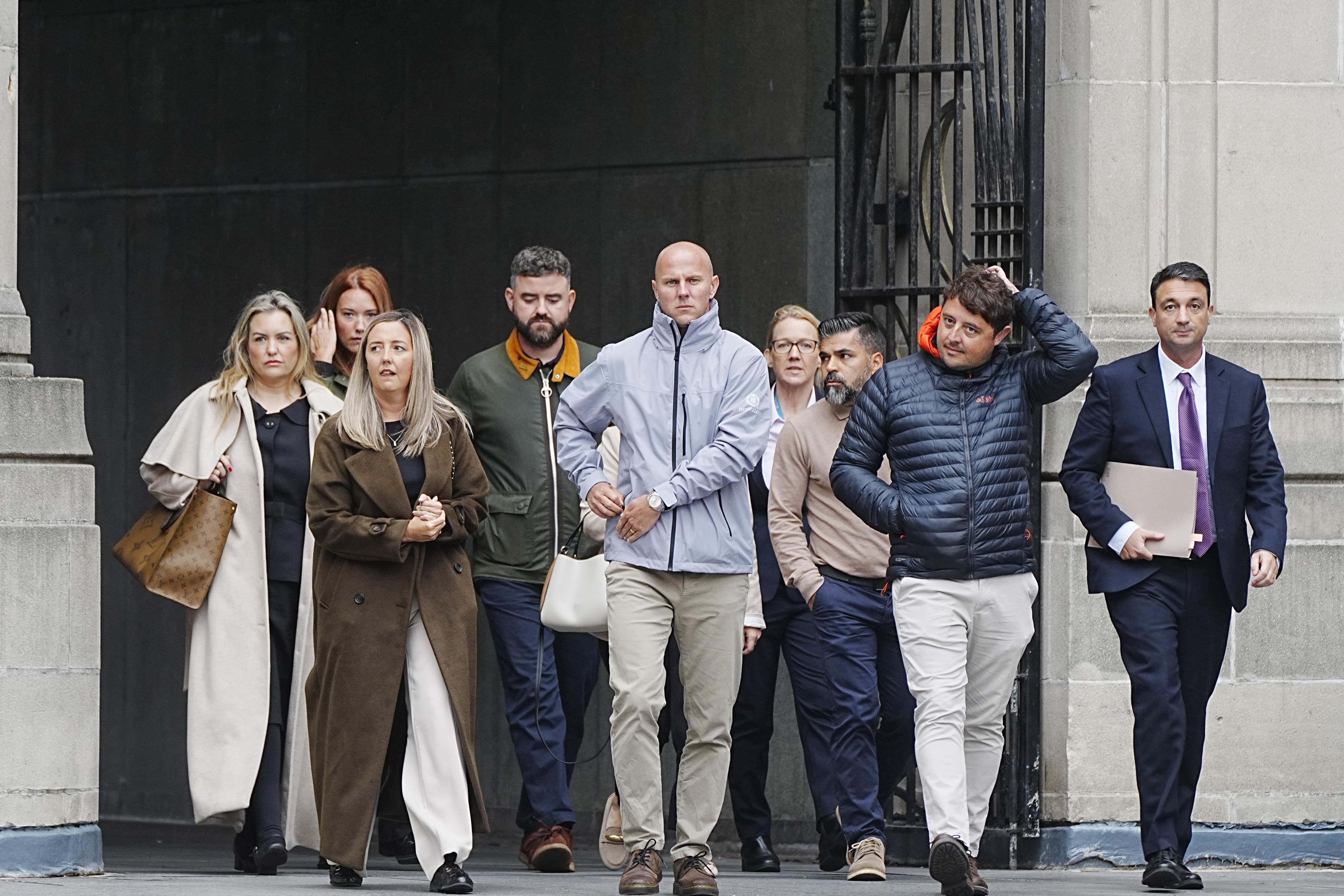 Families of the victims with their legal team arrive at Liverpool Town Hall (Peter Byrne/PA)