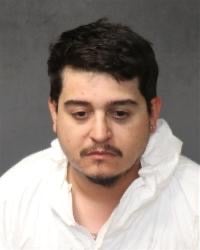 Ismael Rene Tena, 27, has been arrested for fatally shooting two workers at a New Mexico auto parts store over a dispute about oil, police say