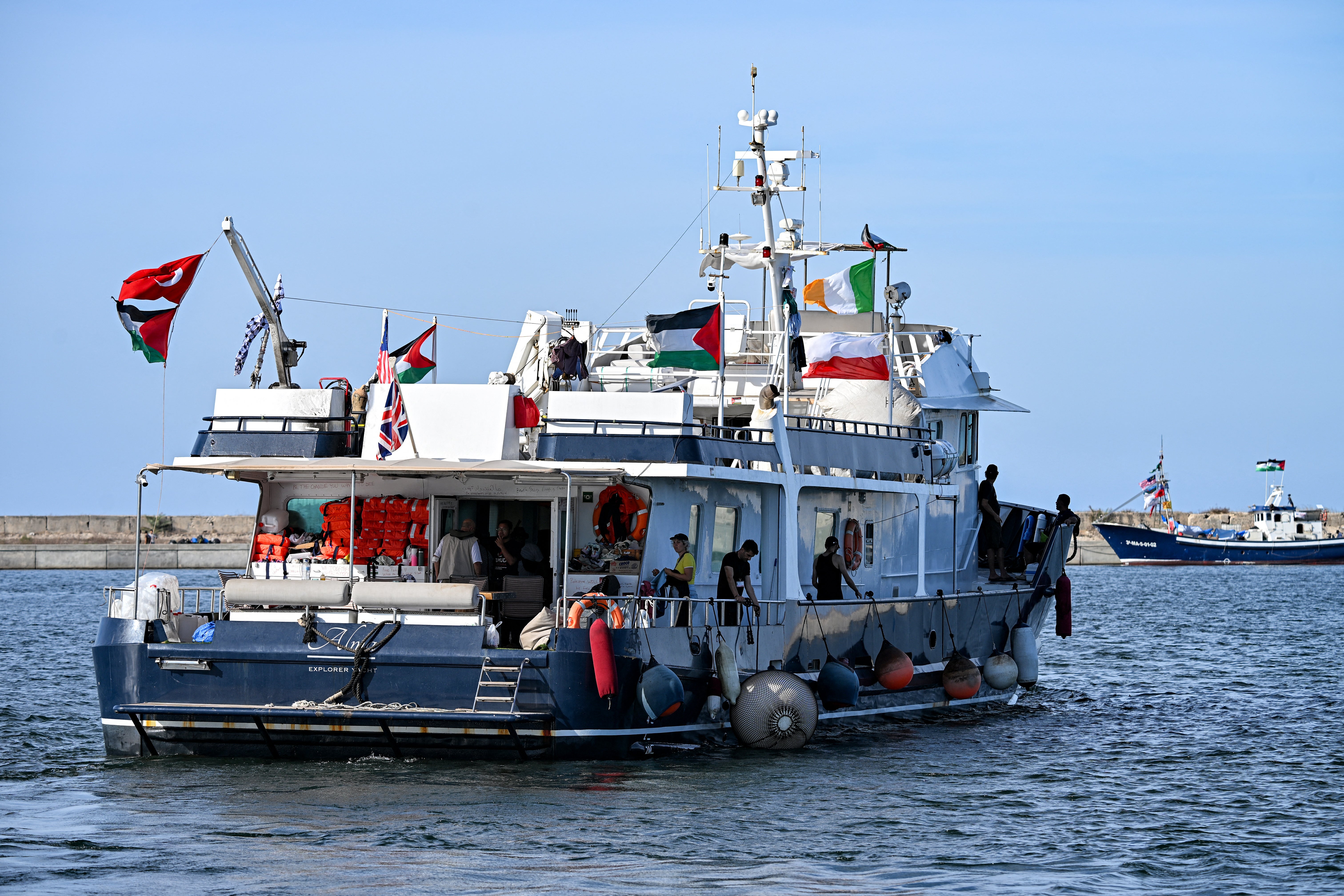 Activists and human rights defenders ride aboard one of the vessels, departing from Tunisia’s northern port of Bizerte