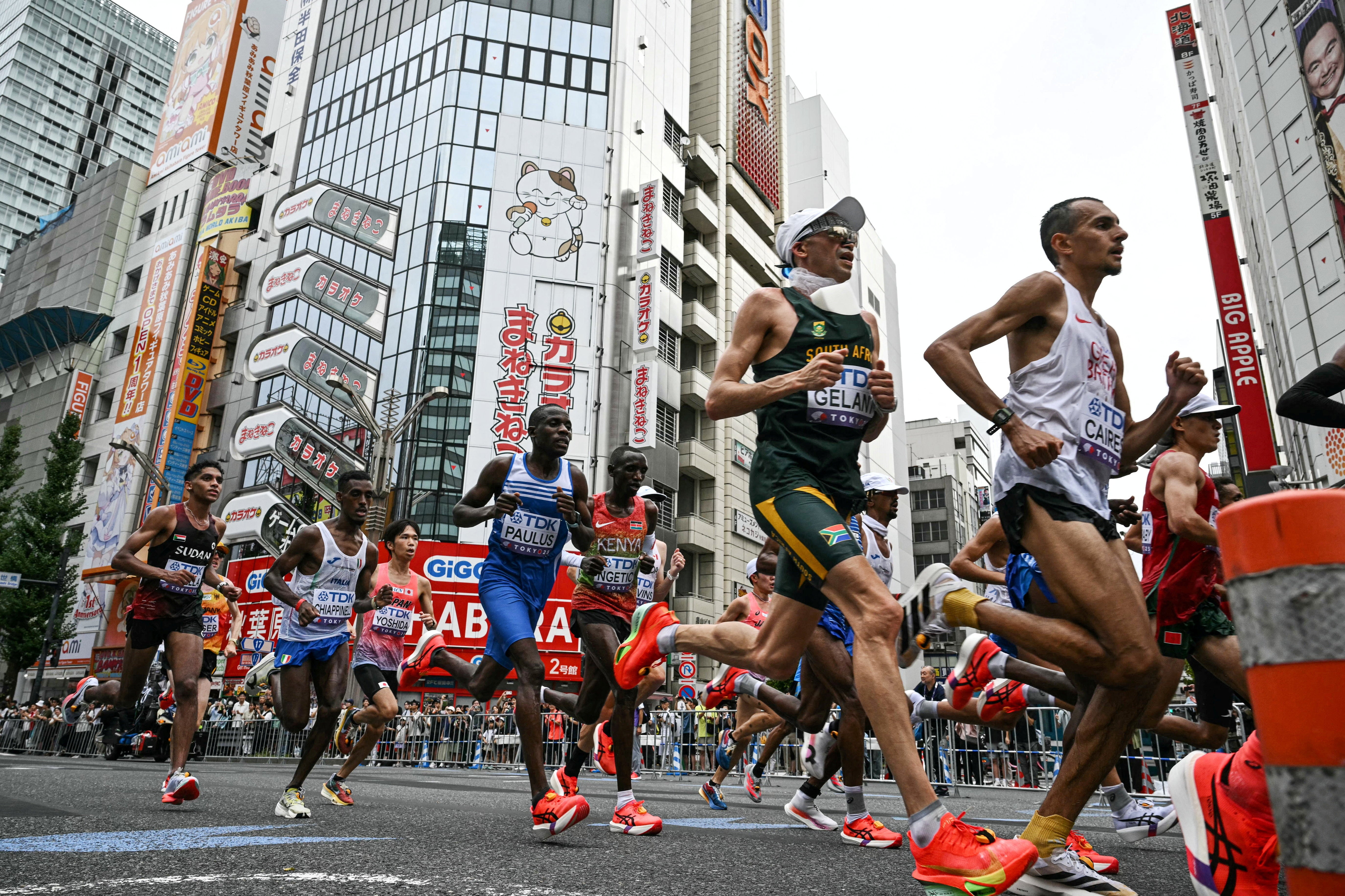 Britain's Emile Cairess in action with other athletes