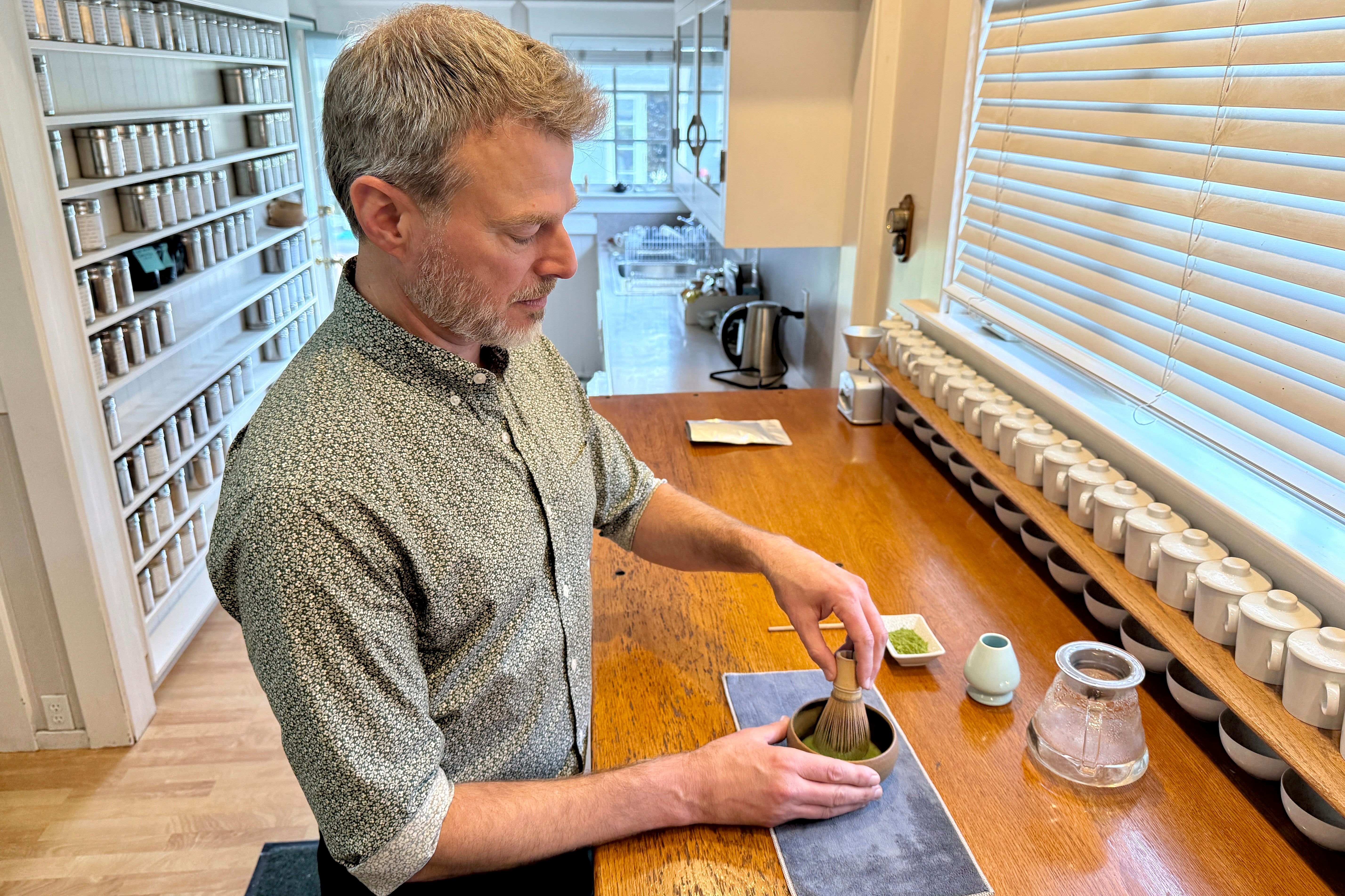 Senior Tea Buyer Aaron Vick uses a whisk to make a matcha drink inside The G.S. Haly Company's tea tasting room in Redwood City, Calif., Wednesday, Sept. 10, 2025. (AP Photo/Haven Daley)