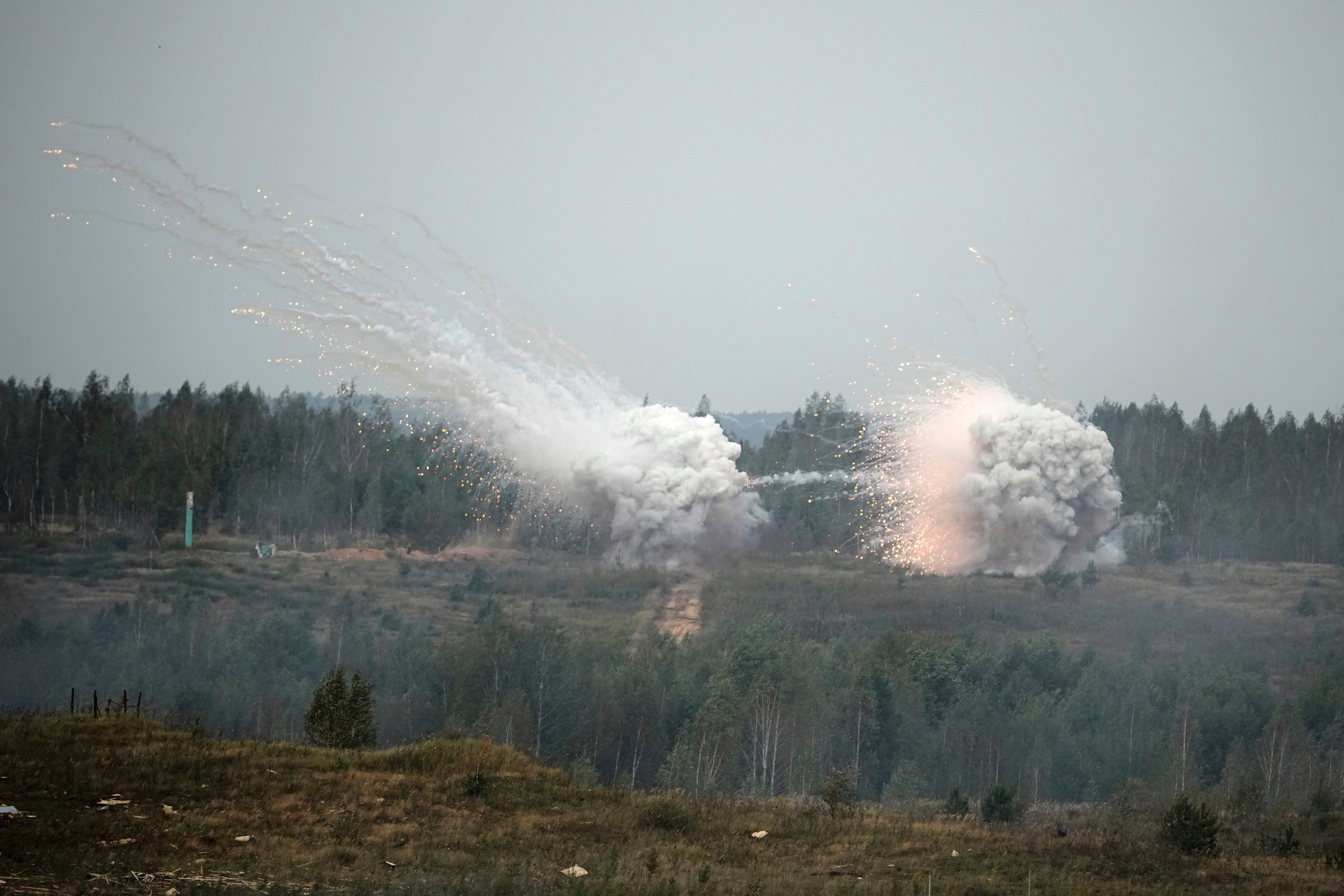 Russia Belarus Explosions are seen during joint Russian-Belarusian military drills at a training ground near Barysaw, Belarus, Monday, Sept. 15, 2025. (AP Photo/Pavel Bednyakov) Drills