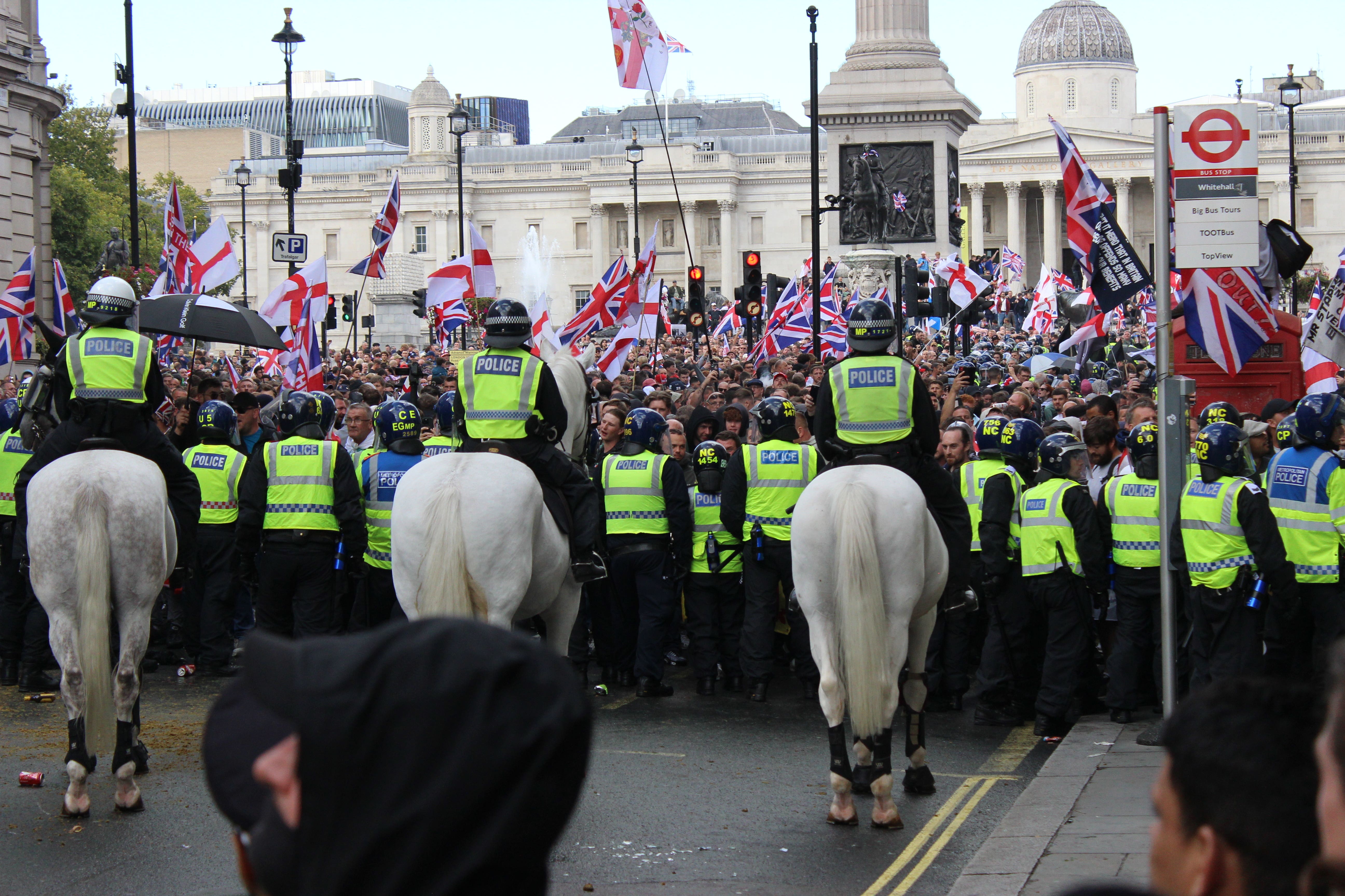 Police push back protesters taking part in the Tommy Robinson-led Unite the Kingdom march and rally (Pol Allingham/PA)