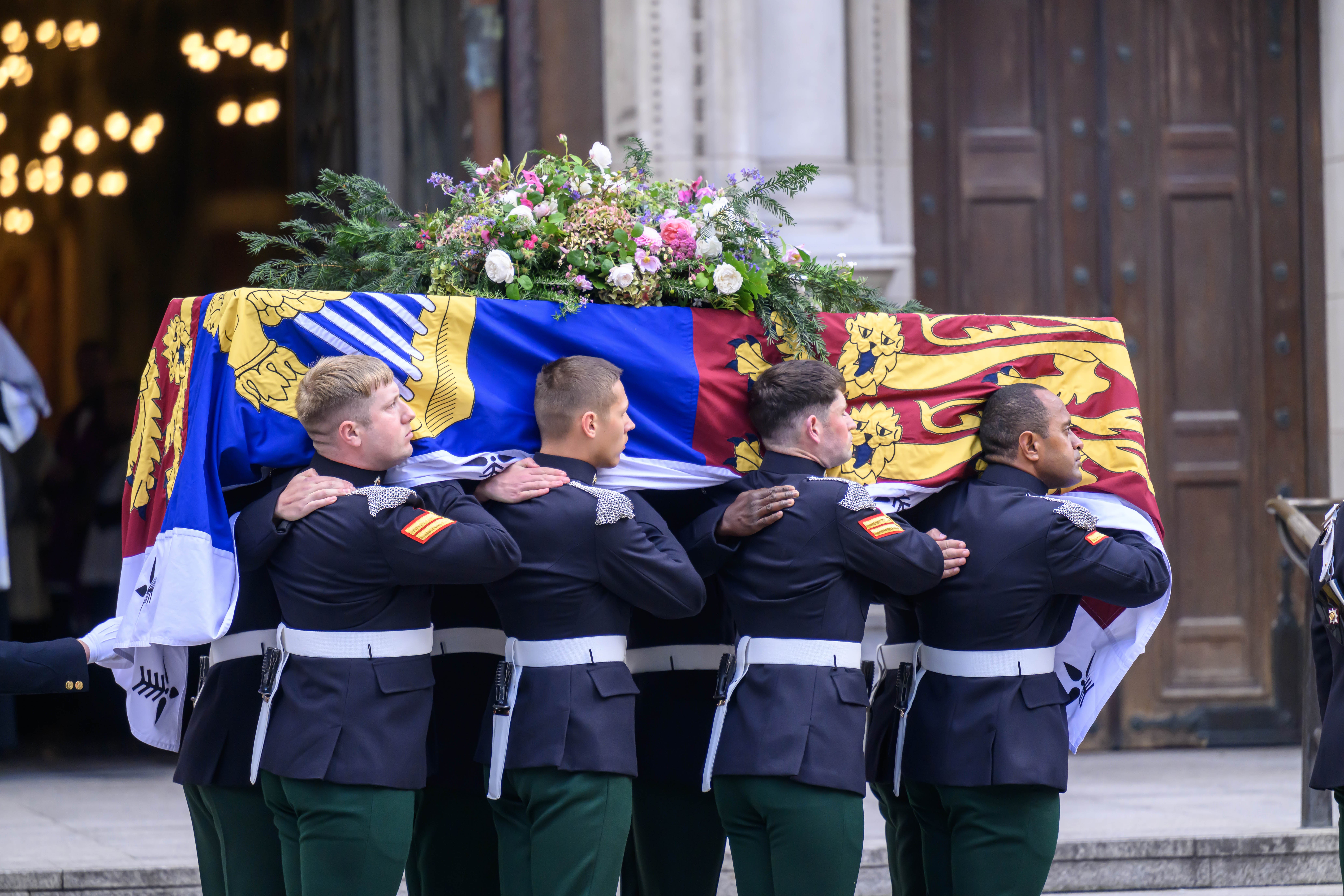 The bearer party carry the coffin of the Duchess of Kent into Westminster Cathedral