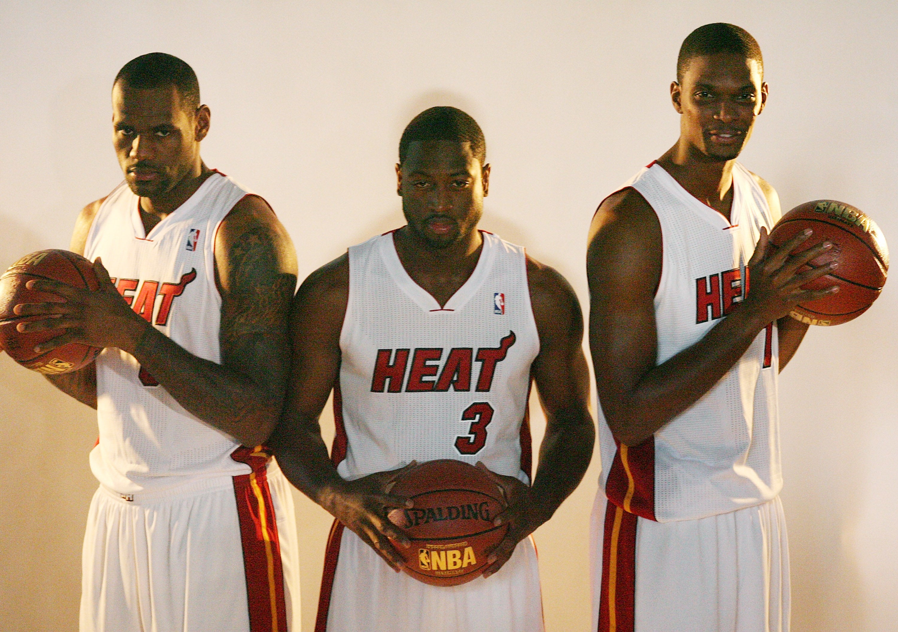 Bosh (right) with ex-teammates LeBron James (left) and Dwayne Wade (center). Bosh's former personal assistant is hauling him and his wife into court over working conditions she claims were intolerable