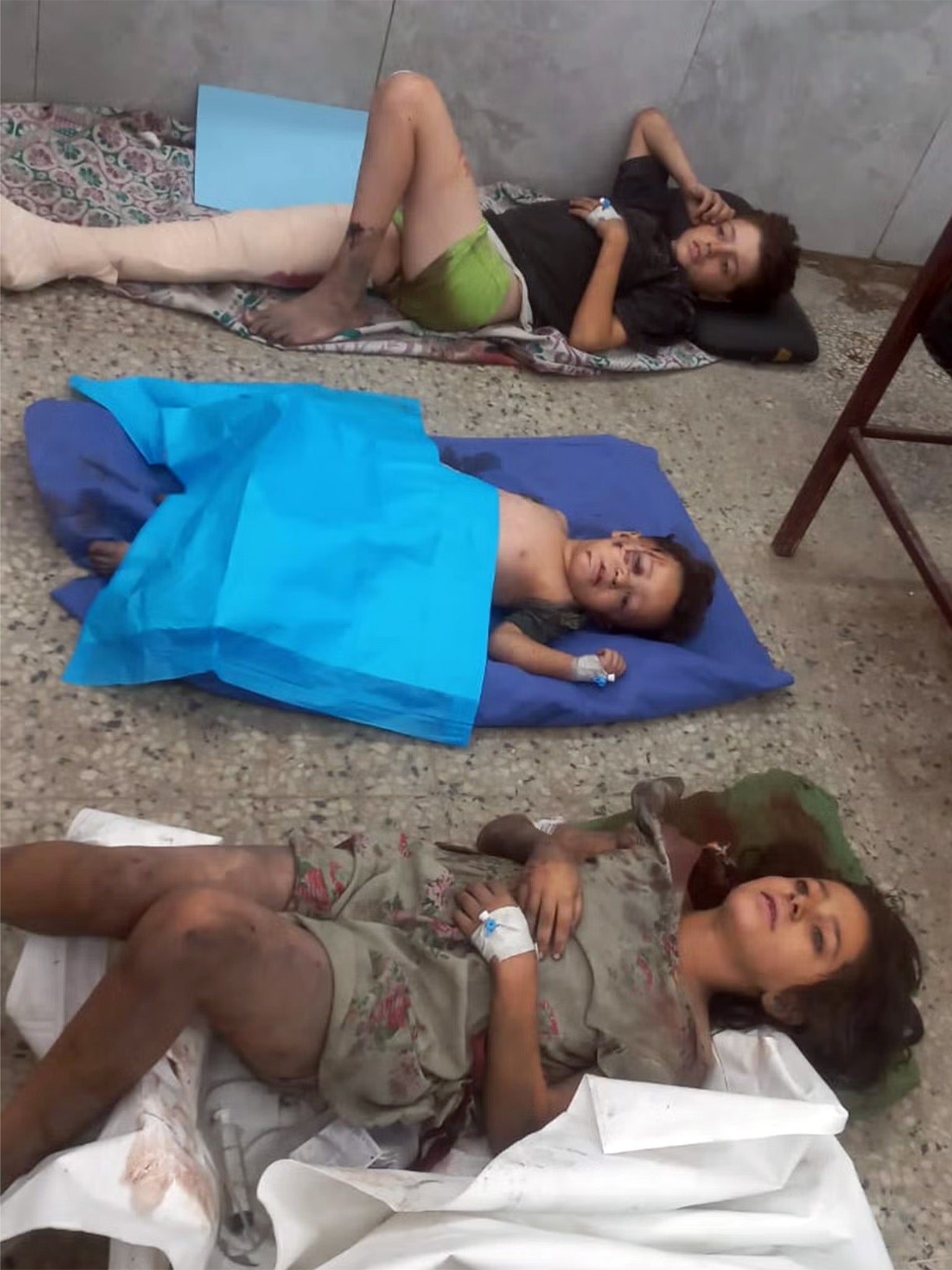 Photos shared by doctors of children being treated on the ground in al-Shifa hospital