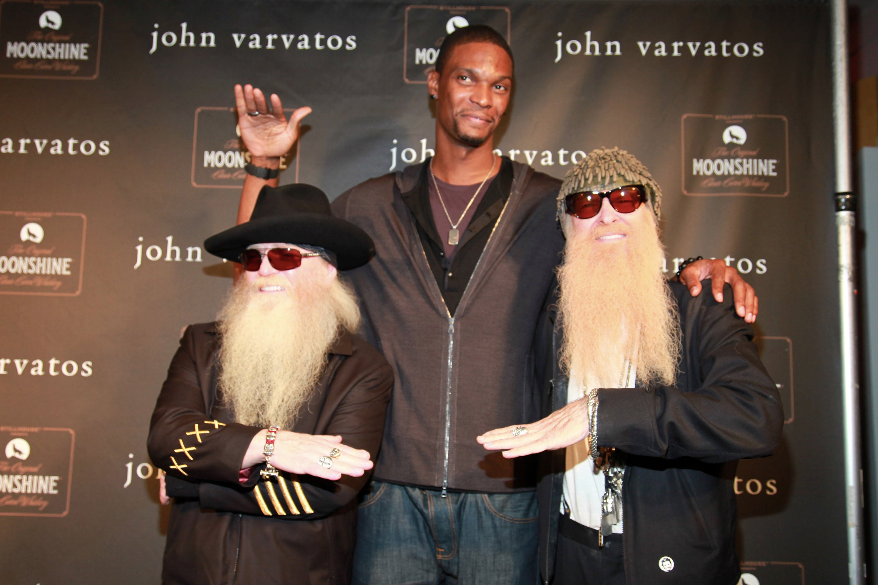 Bosh, seen here with Dusty Hill (left) and Billy Gibbons (right) of ZZ Top, is facing allegations in civil court from his former personal assistant, who claims working for him and wife Adrienne left her with debilitating panic attacks