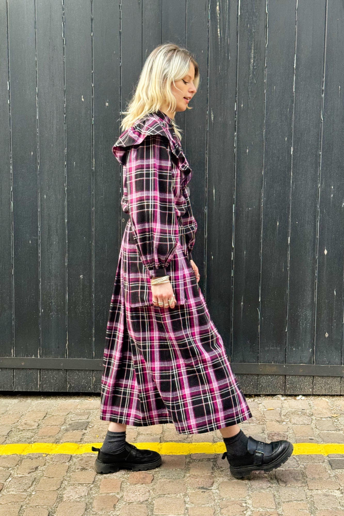 Shayla Sakora wears Statement Frill Blouse and Ruth Skirt in Berry and Black Check