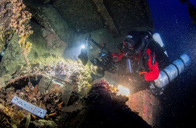 <p>In this undated photo provided by the Greek Culture Ministry on Monday, Sept. 15, 2025, divers illuminate the wreck's interior of the Britannic, sister ship to the Titanic, for the first time since the ocean liner sank in the Aegean Sea more than a century ago after striking a mine during World War I. (Greek Culture Ministry via AP)</p>
