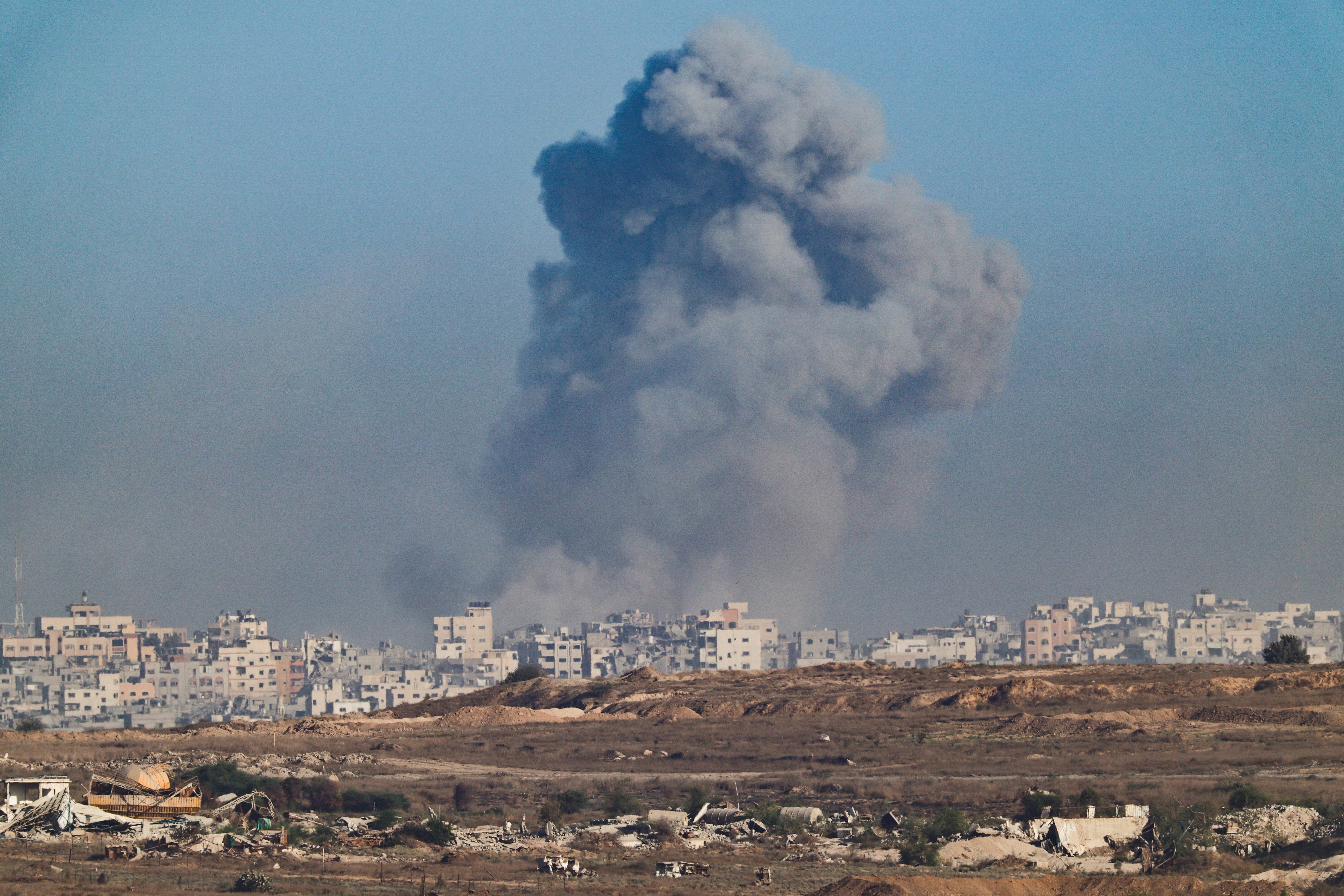 Smoke rises from Gaza after an explosion, as seen from the Israeli side of the border, on Tuesday