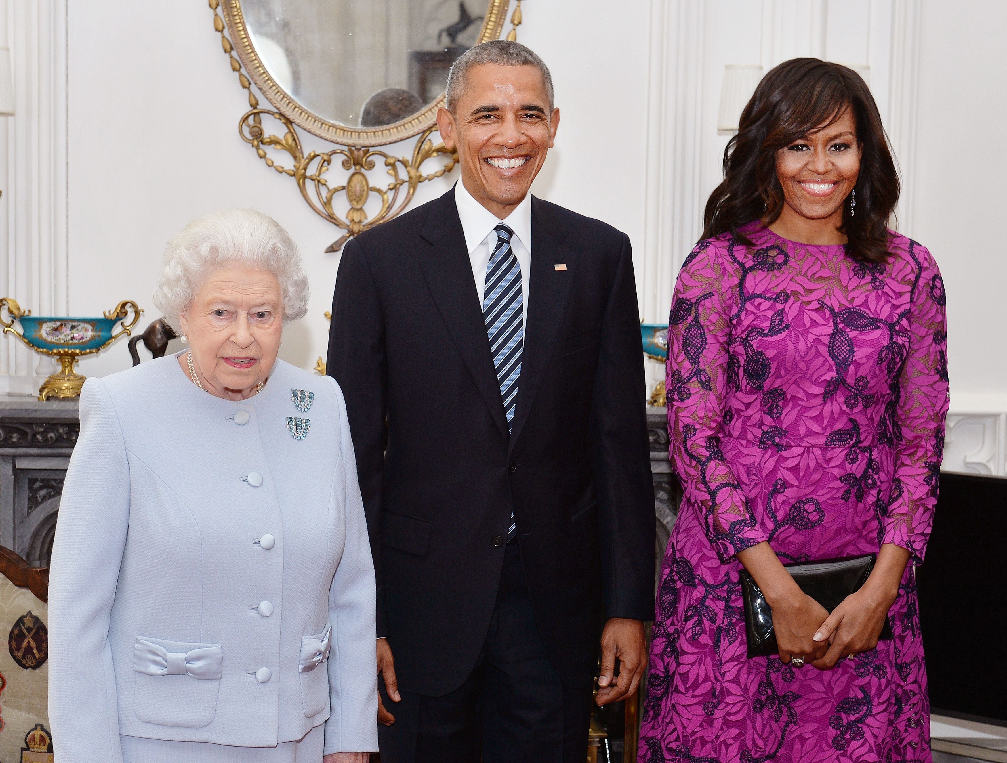 Queen Elizabeth II (left) stands with the President and First Lady of the United States Barack Obama and his wife Michelle, in the Oak Room at Windsor Castle ahead of a private lunch hosted by the Queen