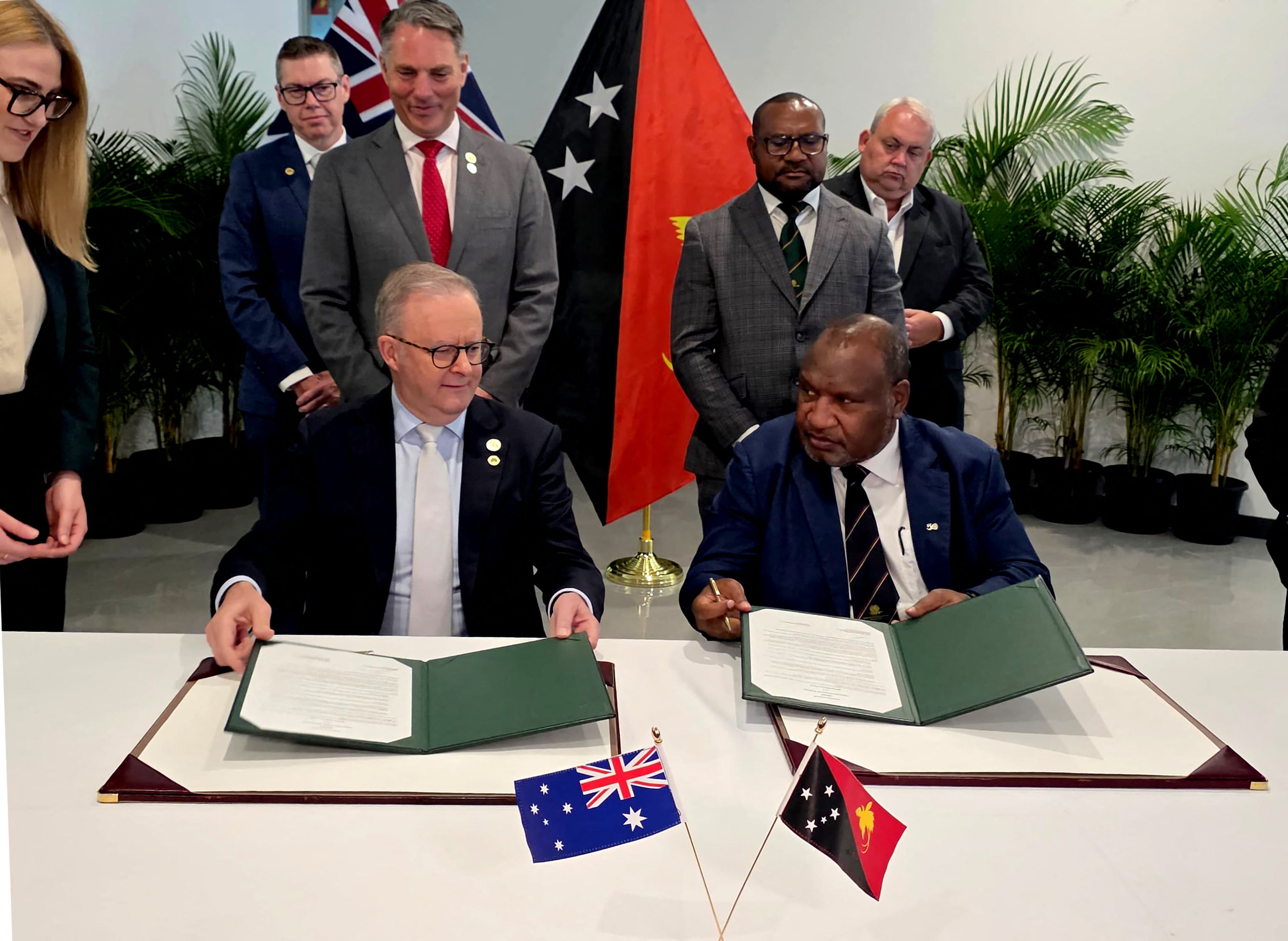 James Marape and Anthony Albanese sign a communique in Port Moresby on 17 September 2025