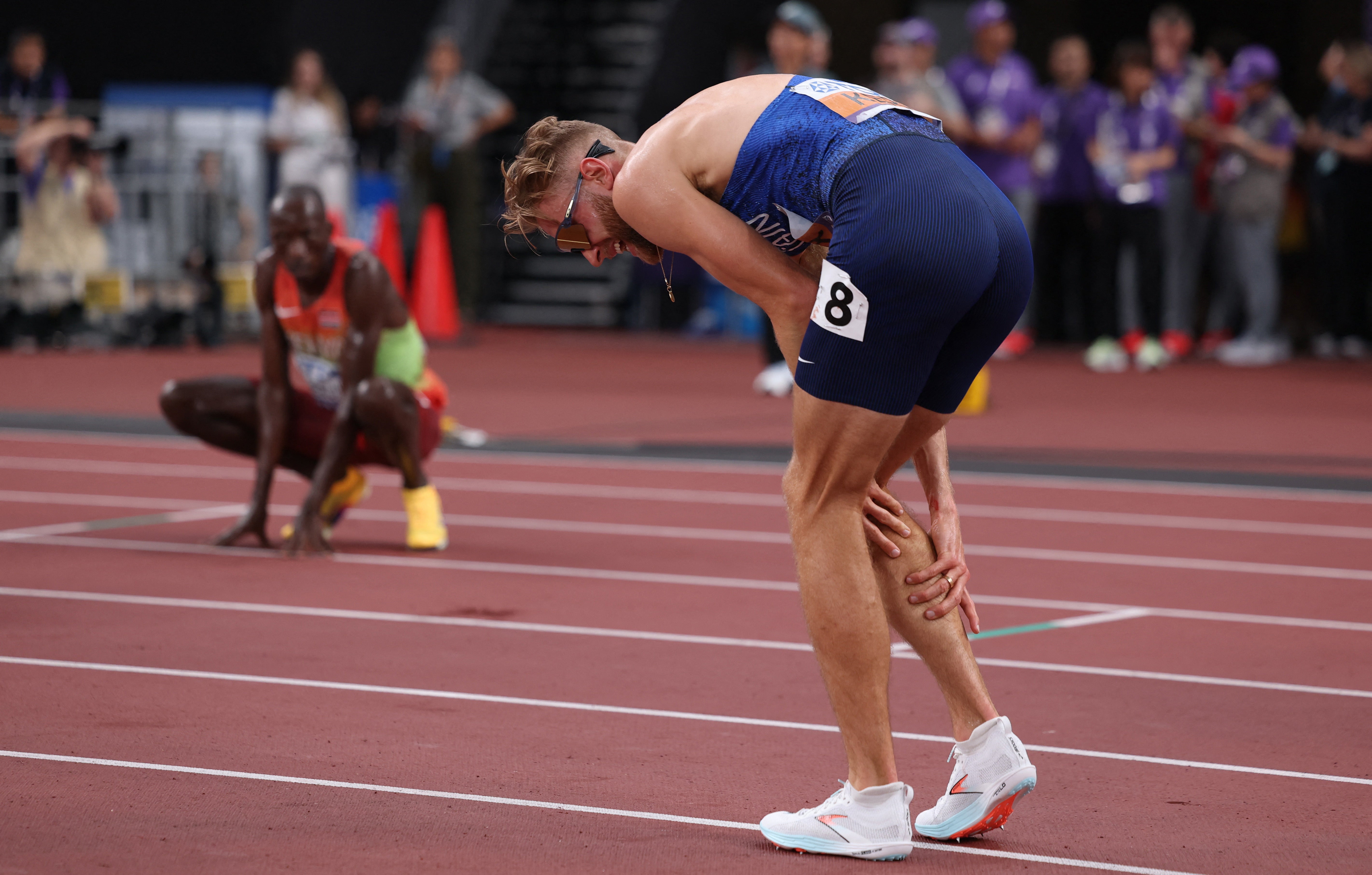 Josh Kerr doubled over in pain following the race