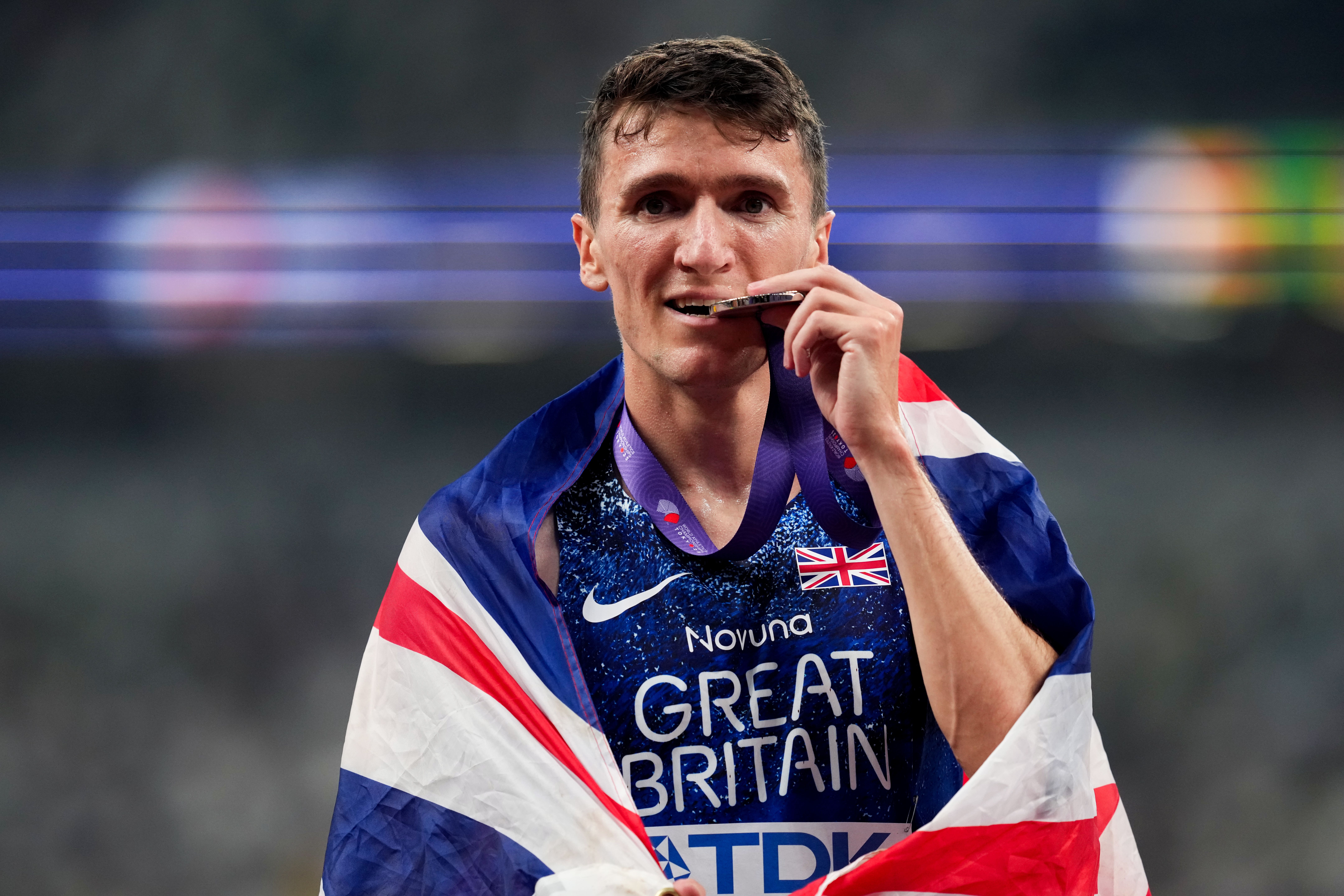 <p>Jake Wightman with his silver medal</p>