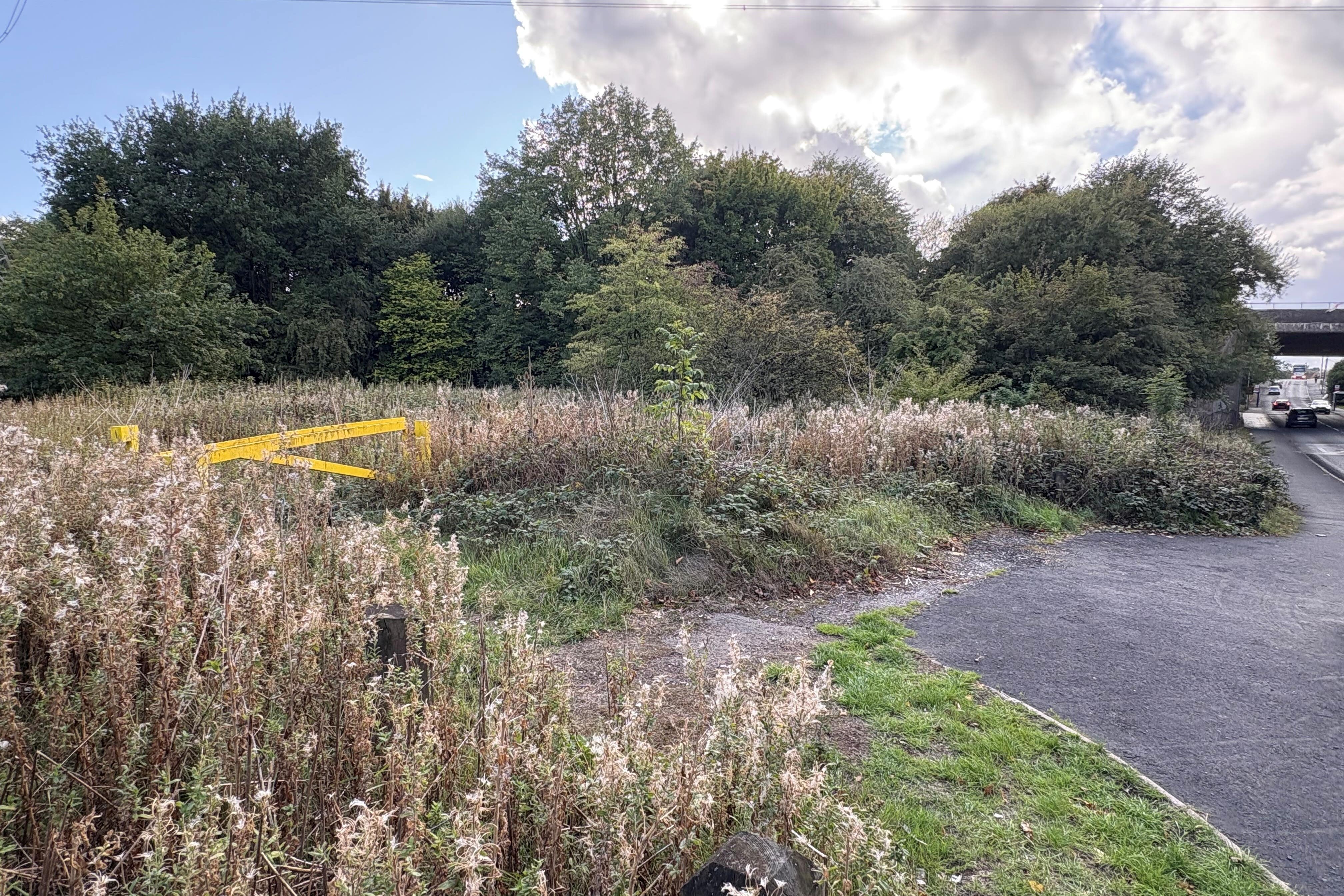 A previously sealed off area of grassland near Tame Road in Oldbury, West Midlands, as police investigate the reported rape of a woman in an alleged racially-motivated attack (Matthew Cooper/PA)