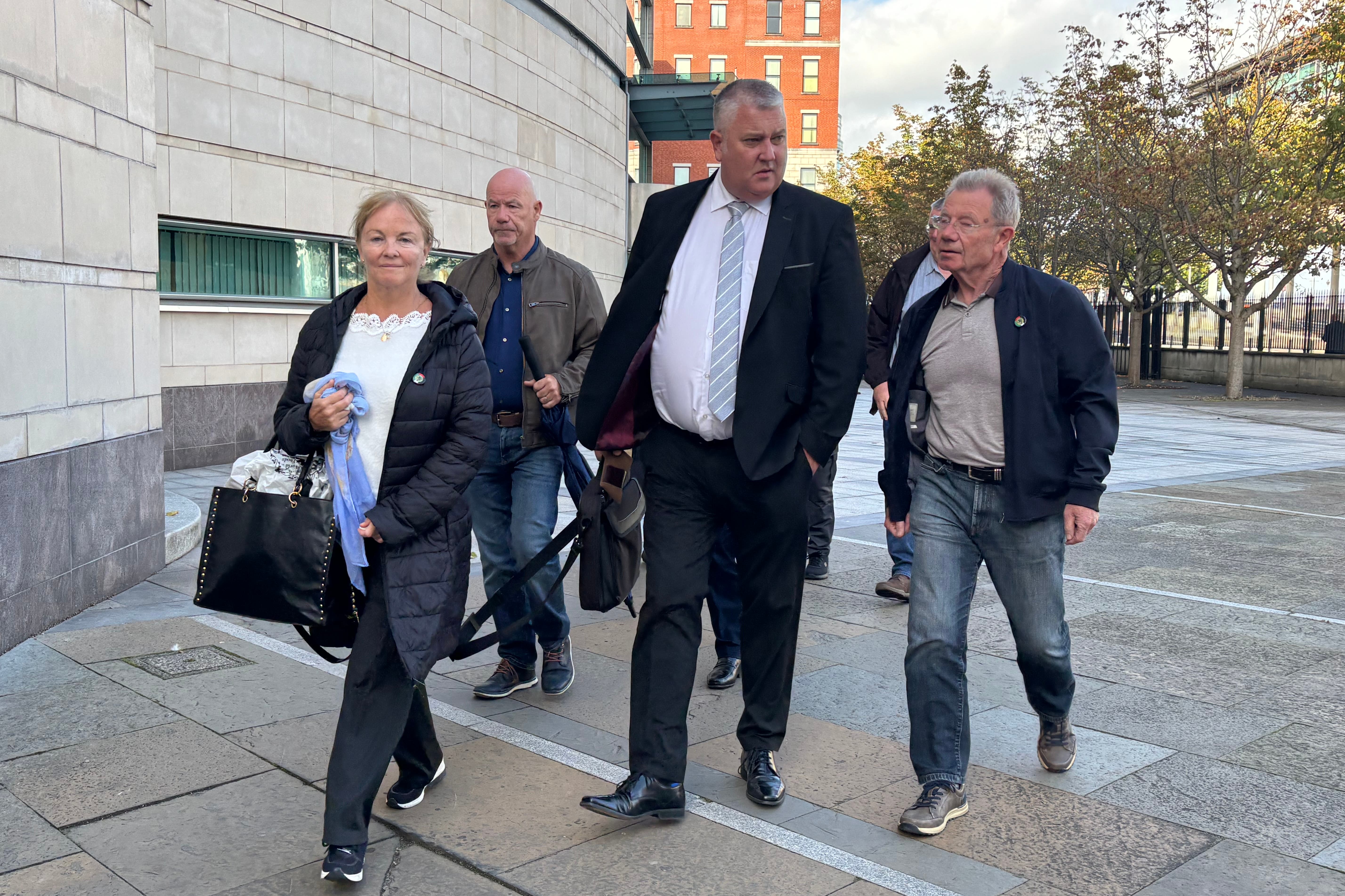 Solicitor Ciaran Shiels with families of those killed on Bloody Sunday in Londonderry in 1972 following a sitting of the trial of army veteran Soldier F at Belfast Crown Court on Wednesday. (Rebecca Black/PA)