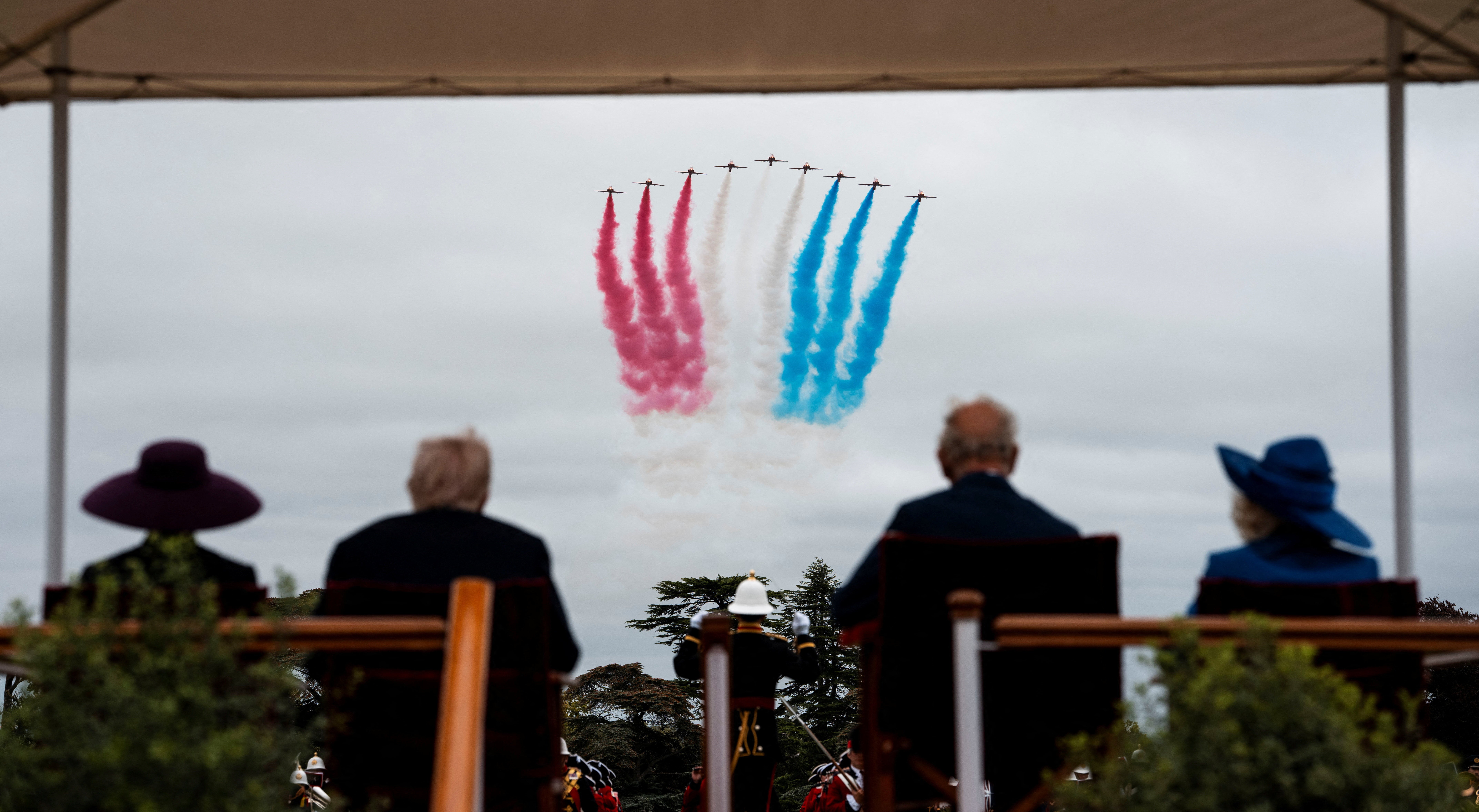 The Red Arrows complete a flypast of Windsor, in a first for a foreign state visit