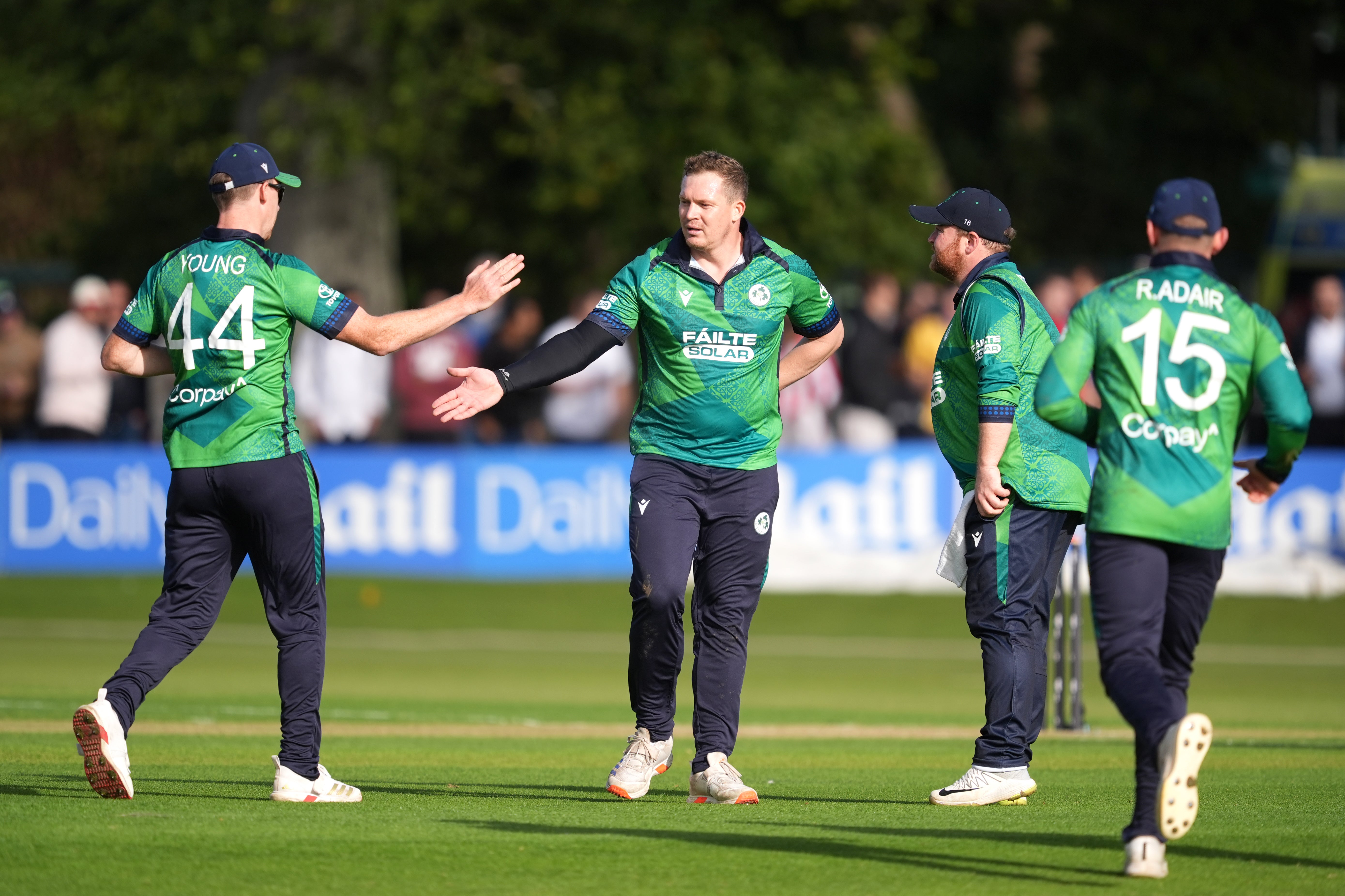 Ireland’s Graham Hume, second left, celebrates the wicket of Phil Salt (PA)