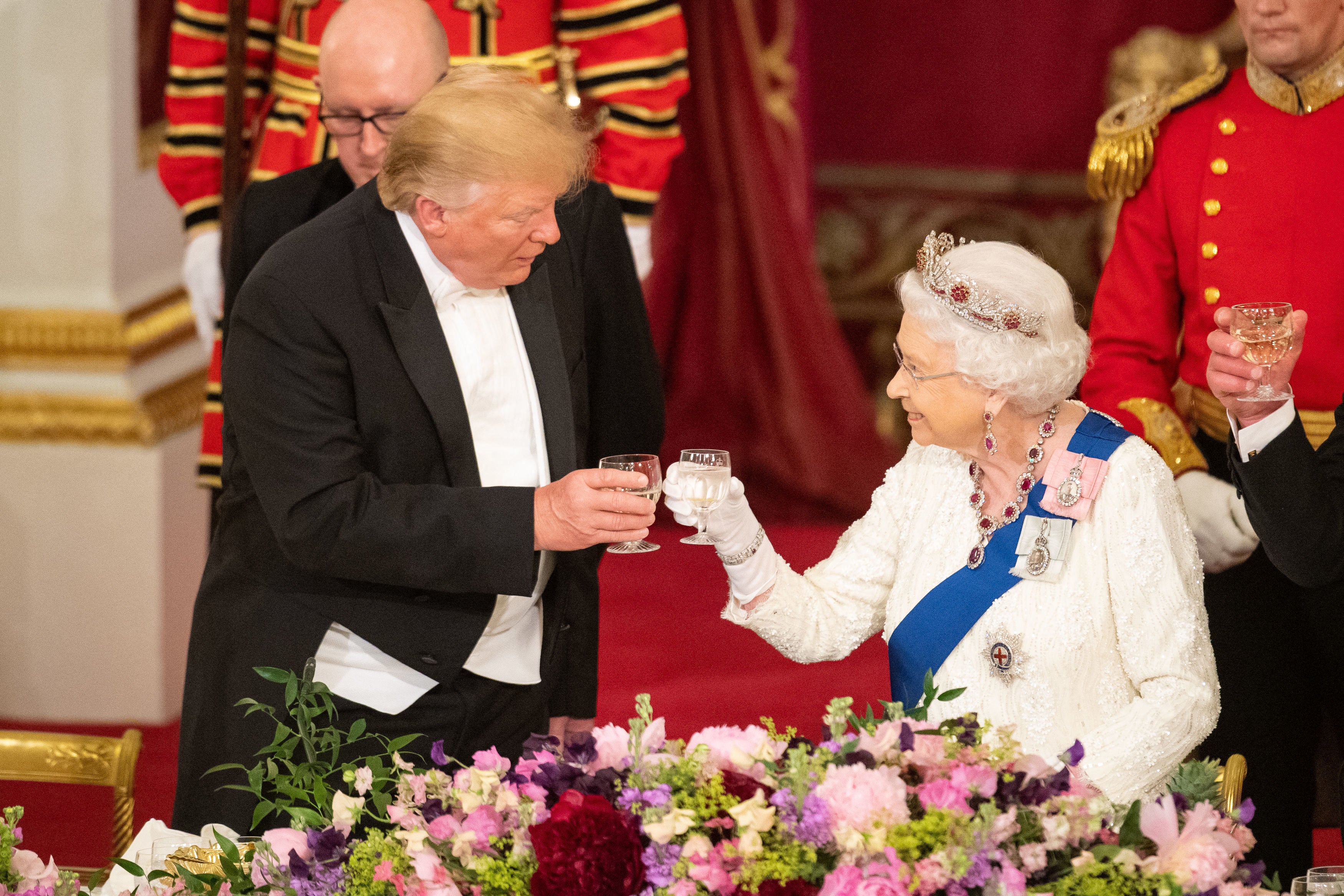 Britain's Queen Elizabeth II (R) raises a glasses with US president Donald Trump during a State Banquet in the ballroom at Buckingham Palace in central London on 3 June 2019