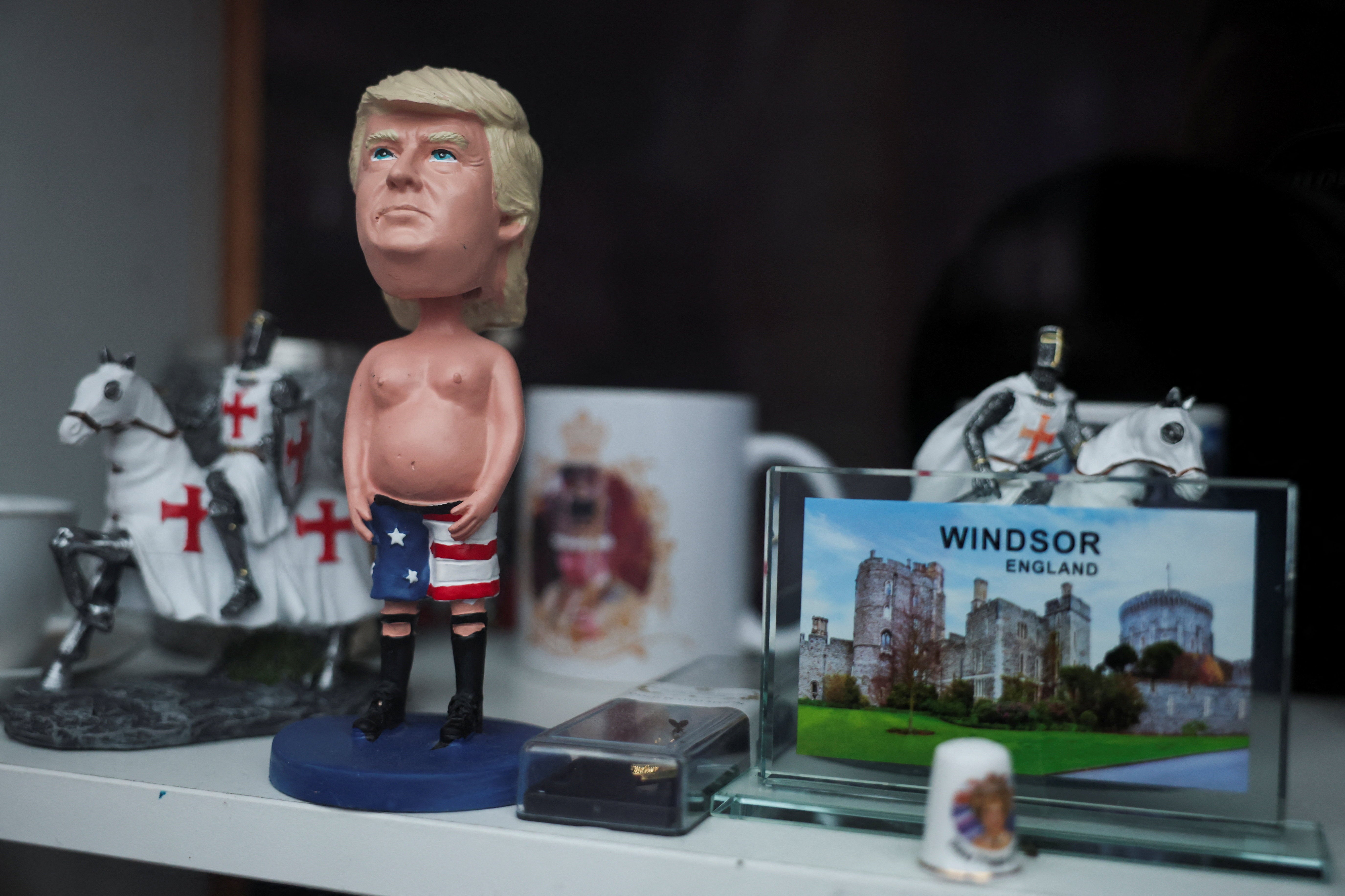 A figurine of U.S. President Donald Trump trump is displayed for sale in the window of a souvenir shop on the day of the state visit of U.S. President Donald Trump and First Lady Melania Trump to the UK, in Windsor, Britain, September 17, 2025. REUTERS/Phil Noble