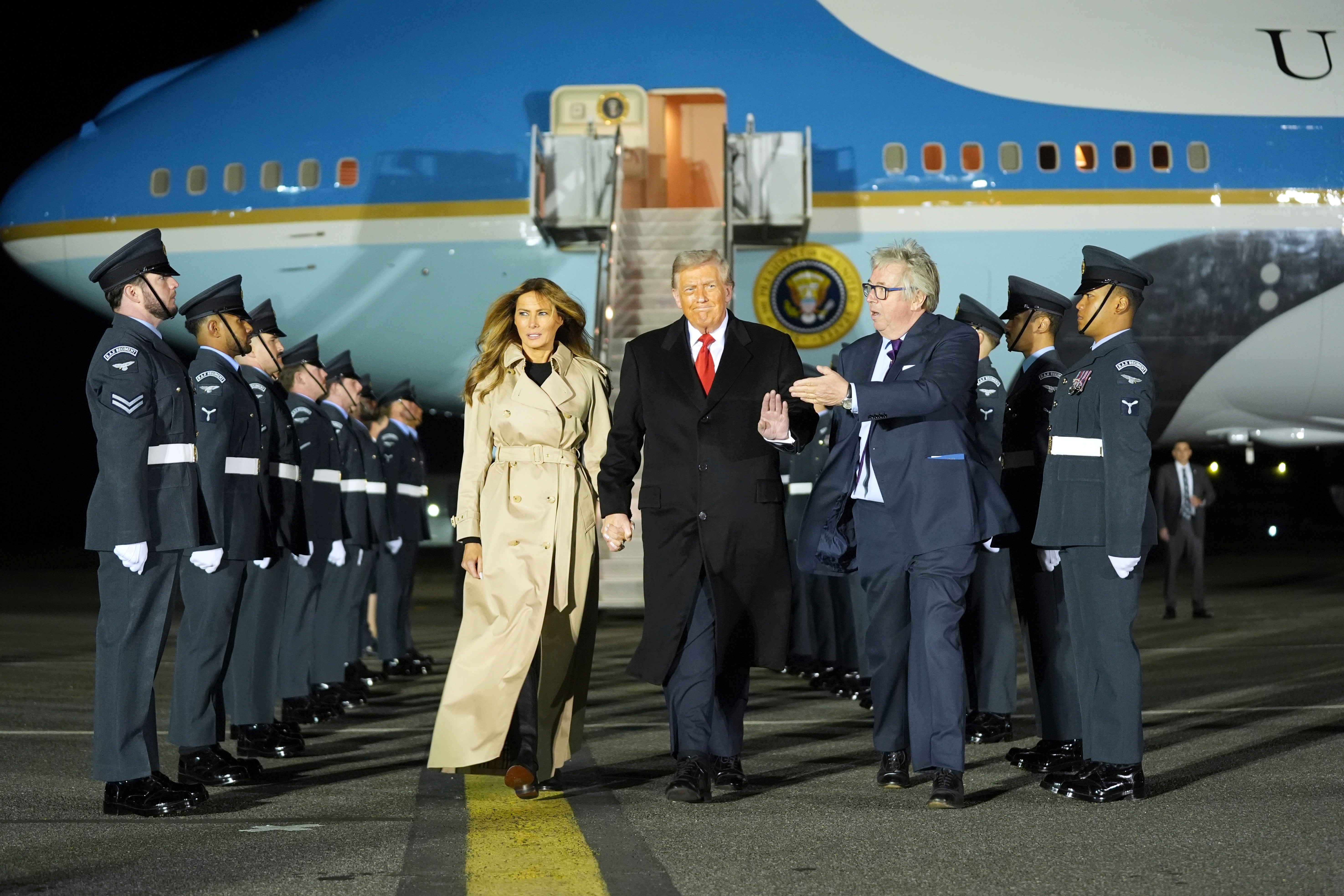 President Donald Trump and first lady Melania Trump are greeted by The Viscount Hood, Lord-in-Waiting, center, right, as they arrive at Stansted Airport near London, Tuesday, Sept. 16, 2025. (AP Photo/Evan Vucci)