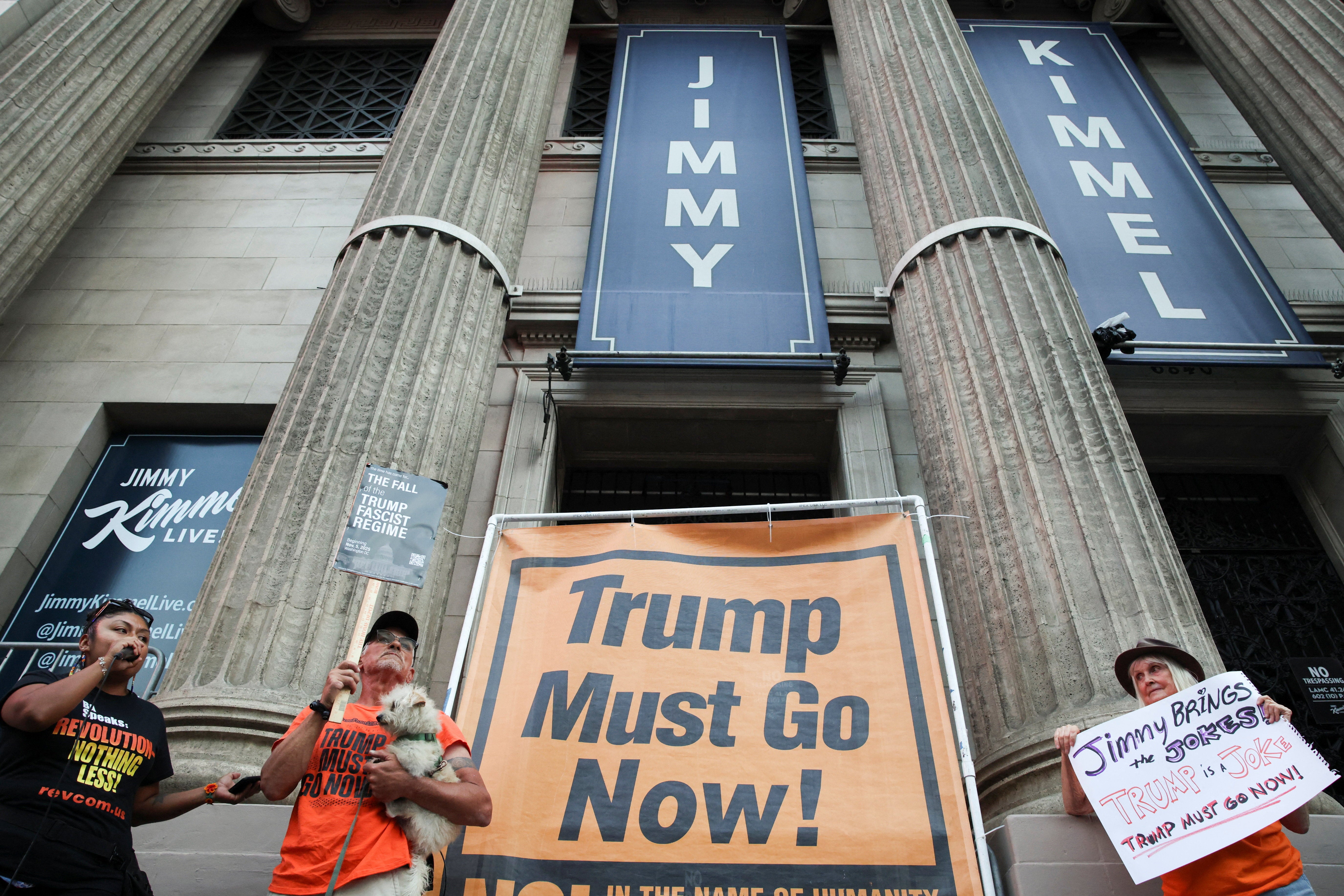 People demonstrate outside the El Capitan Entertainment Centre, where ‘Jimmy Kimmel Live!’ is recorded, on Hollywood Boulevard in Los Angeles on Wednesday