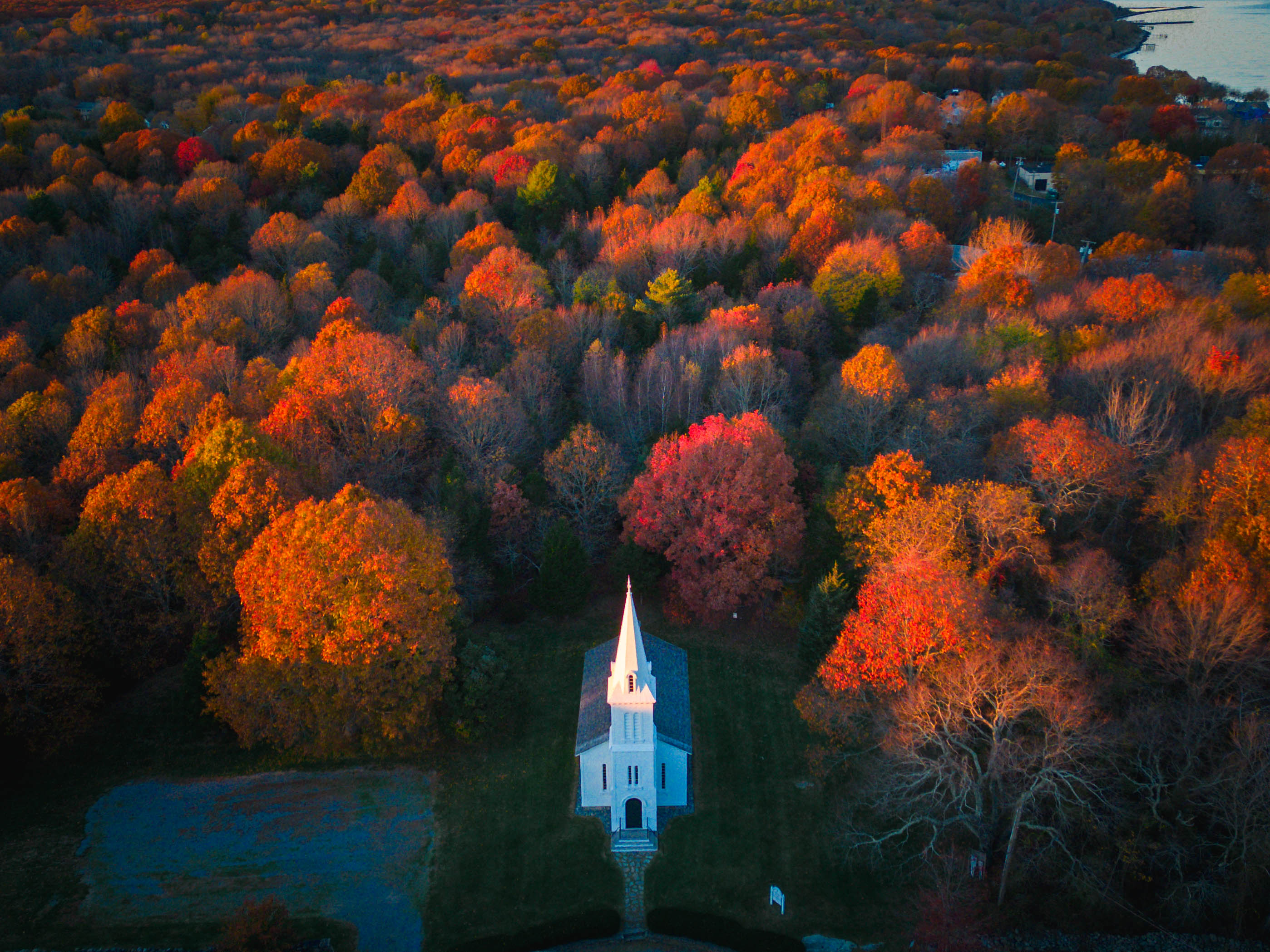 Rhode Island offers top-tier leaf-peeping, particularly in the heavily wooded western and northern areas. Above is South Ferry Church in Narragansett