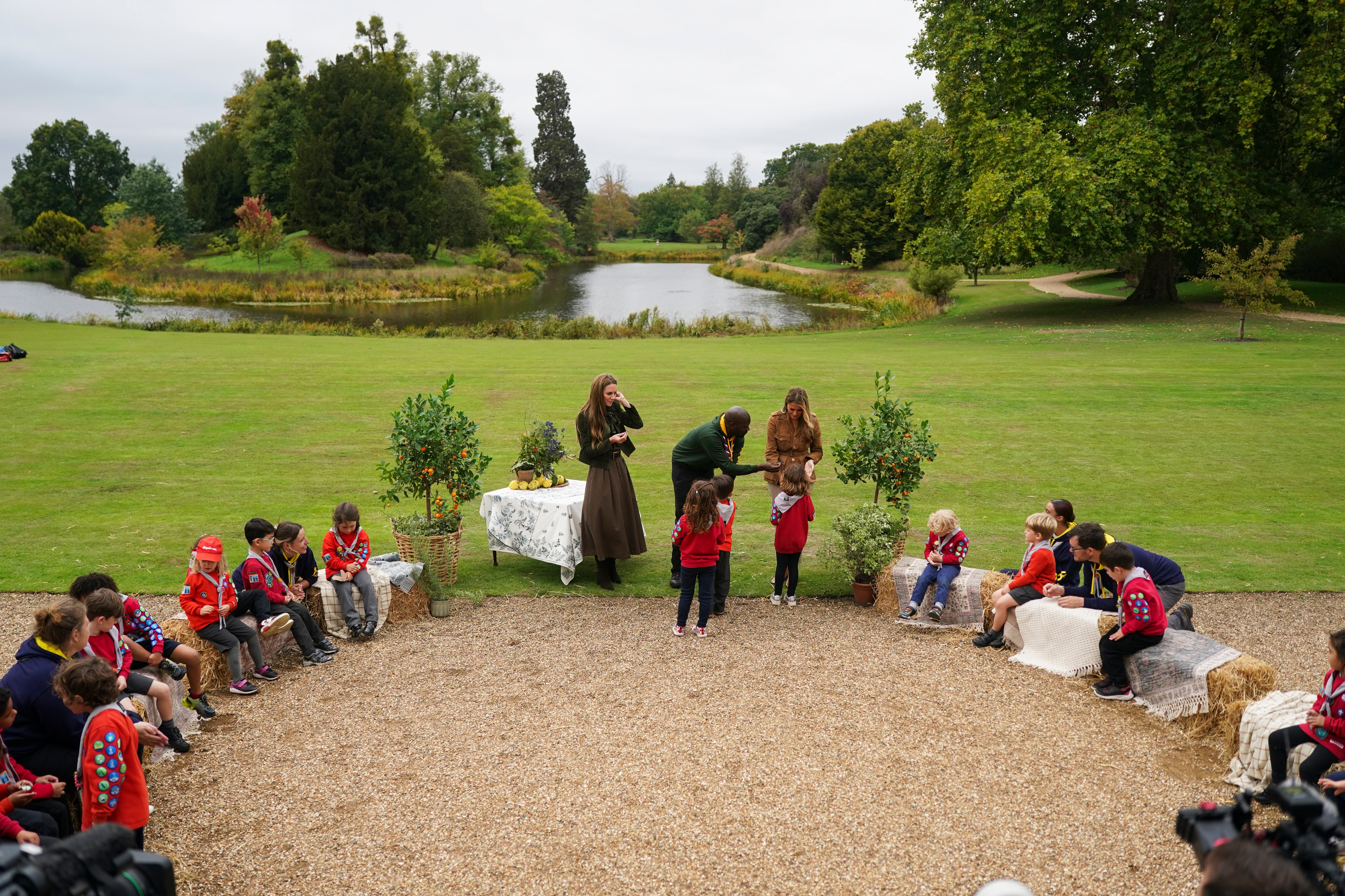US First Lady Melania Trump (C-R) and Catherine, Princess of Wales join Chief Scout for the Scout Association Dwayne Fields as they meet members of the Scouts' Squirrels programme in the grounds of Frogmore Cottage