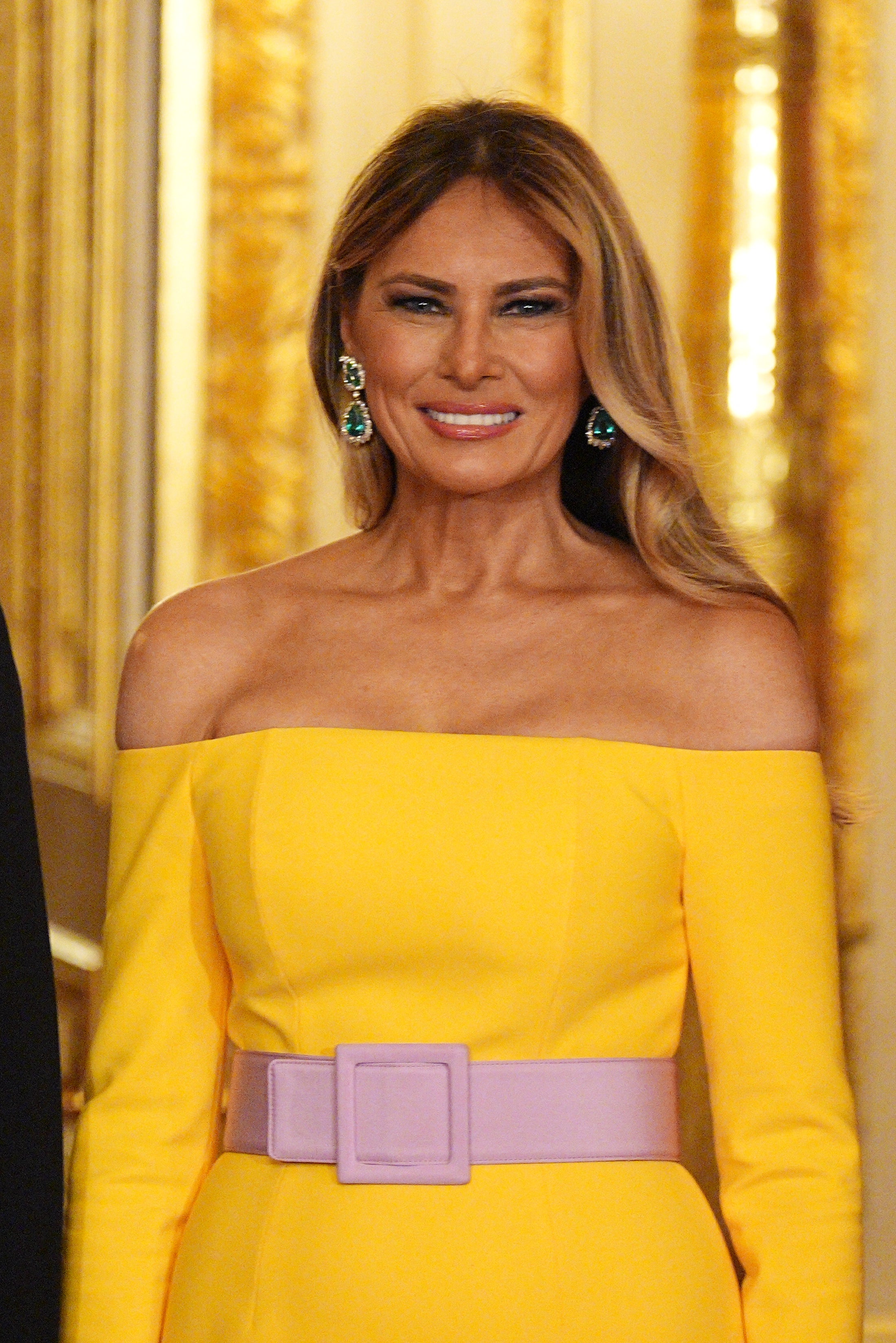 Melania’s emerald and diamond drop earrings made a statement in their own right
