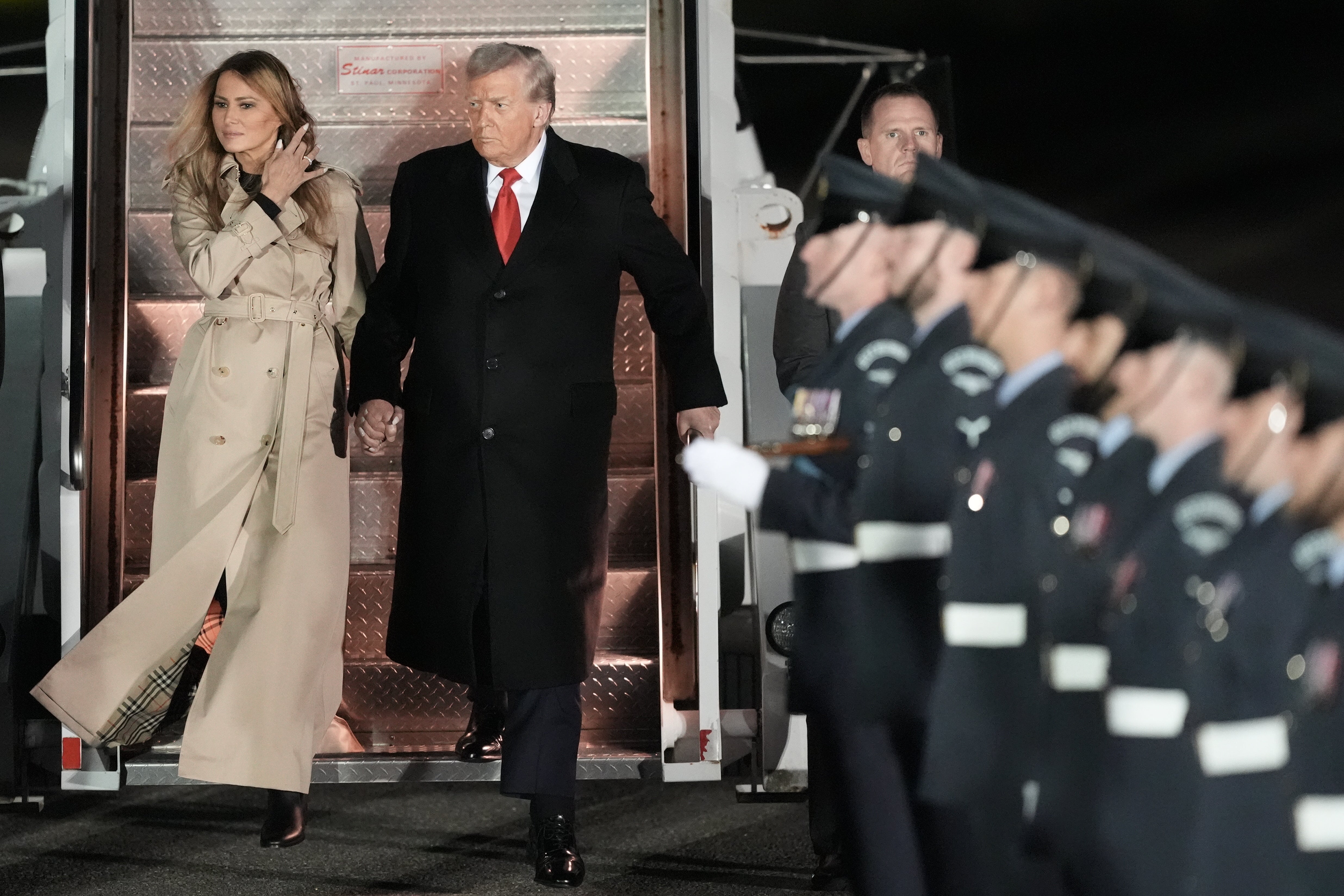 Melania Trump wore a Burberry trench coat when she stepped off the plane at Stansted Airport – a nod to her British surroundings