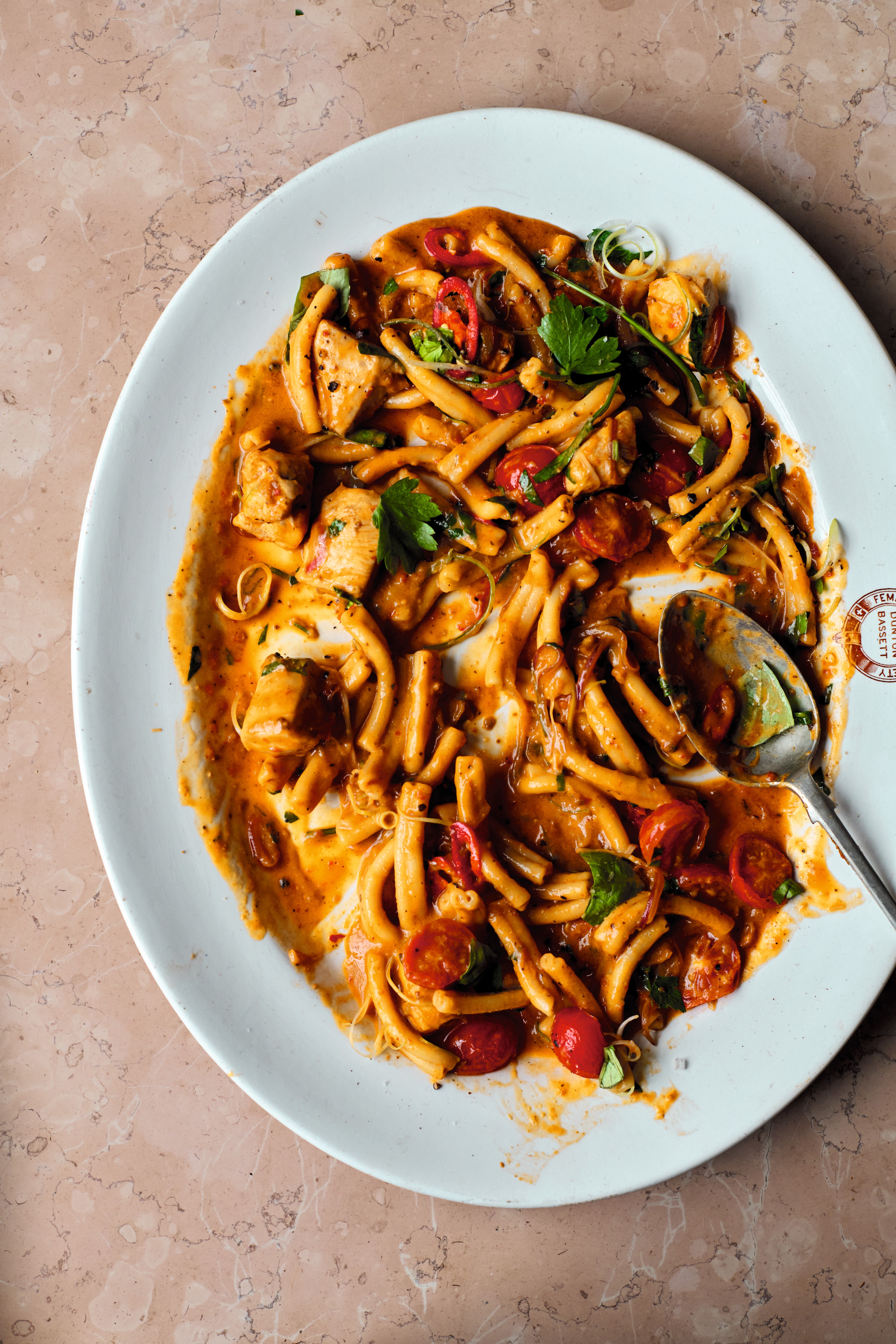 Garlic, pesto and crème fraîche make this chicken pasta pure crowd-pleasing nostalgia