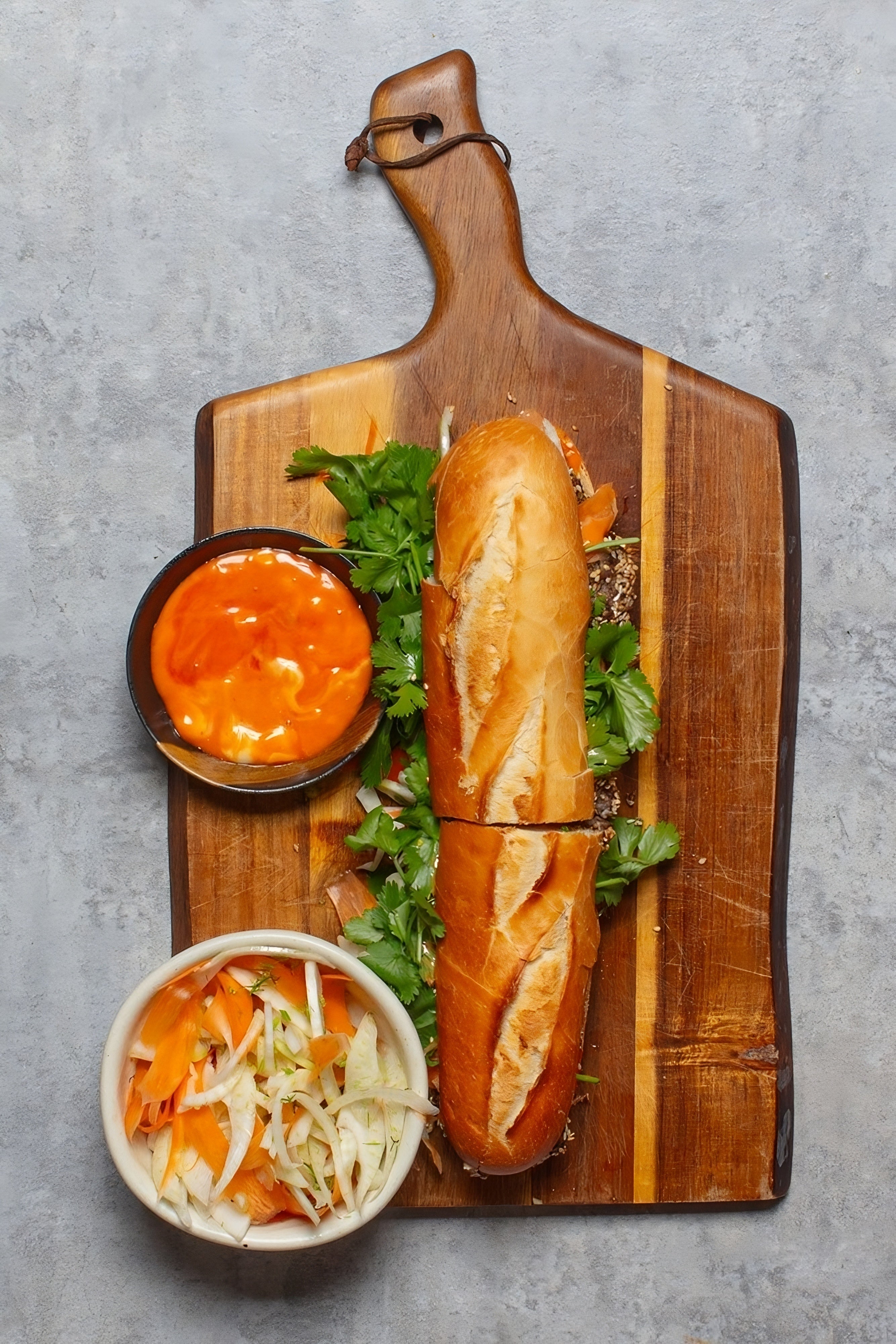 A crusty baguette stuffed with sesame-crusted meatballs and tangy pickles – Vietnam via your air fryer