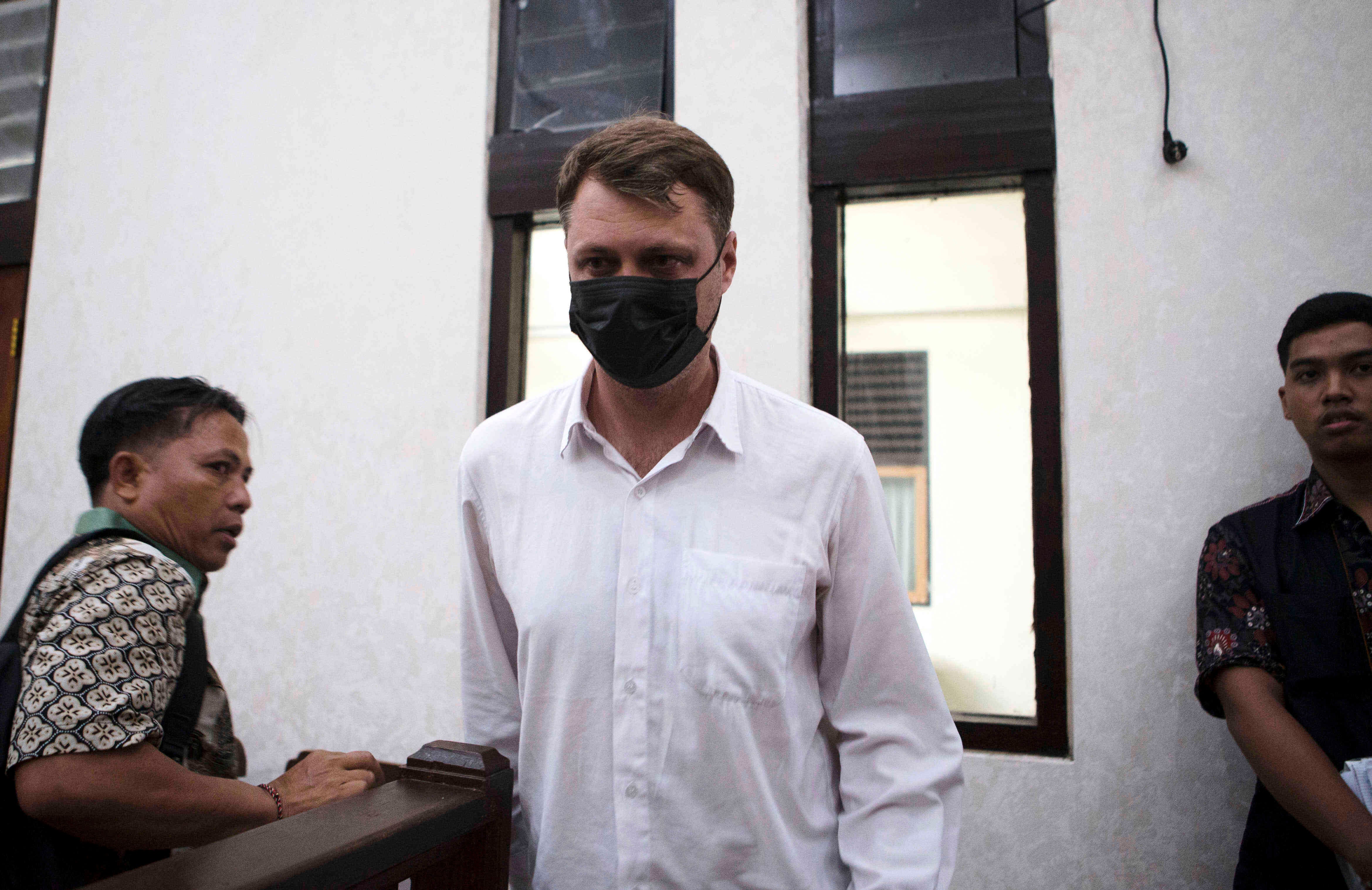Ukrainian citizen Roman Nazarenko, centre, who is on trial on accusation of running a drug lab on the resort island of Bali, arrives for a hearing at the district court in Denpasar, Indonesia, Thursday, 18 September 2025