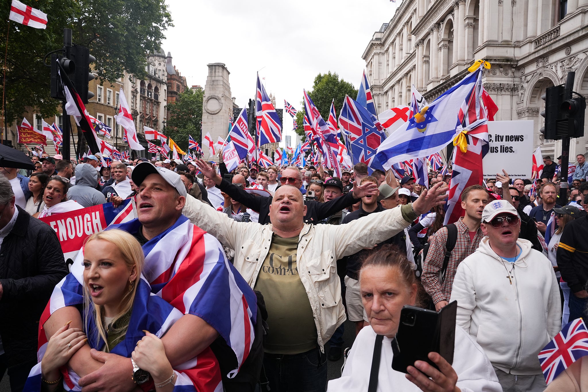 Activists gather at the Cenotaph during the Tommy Robinson-led Unite the Kingdom march and rally in central London