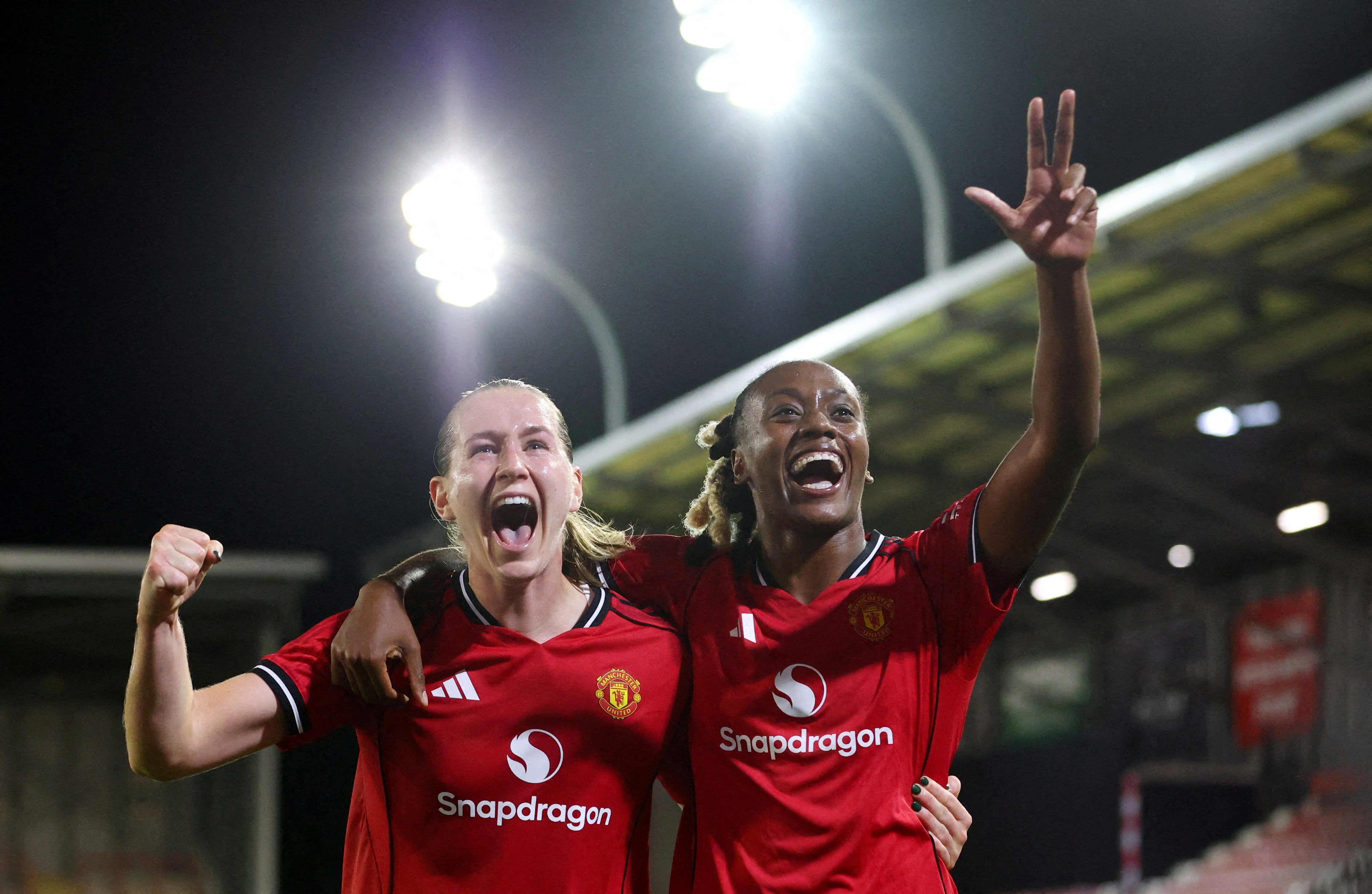 Manchester United's Elisabeth Terland celebrates completing her hat-trick with Melvine Malard
