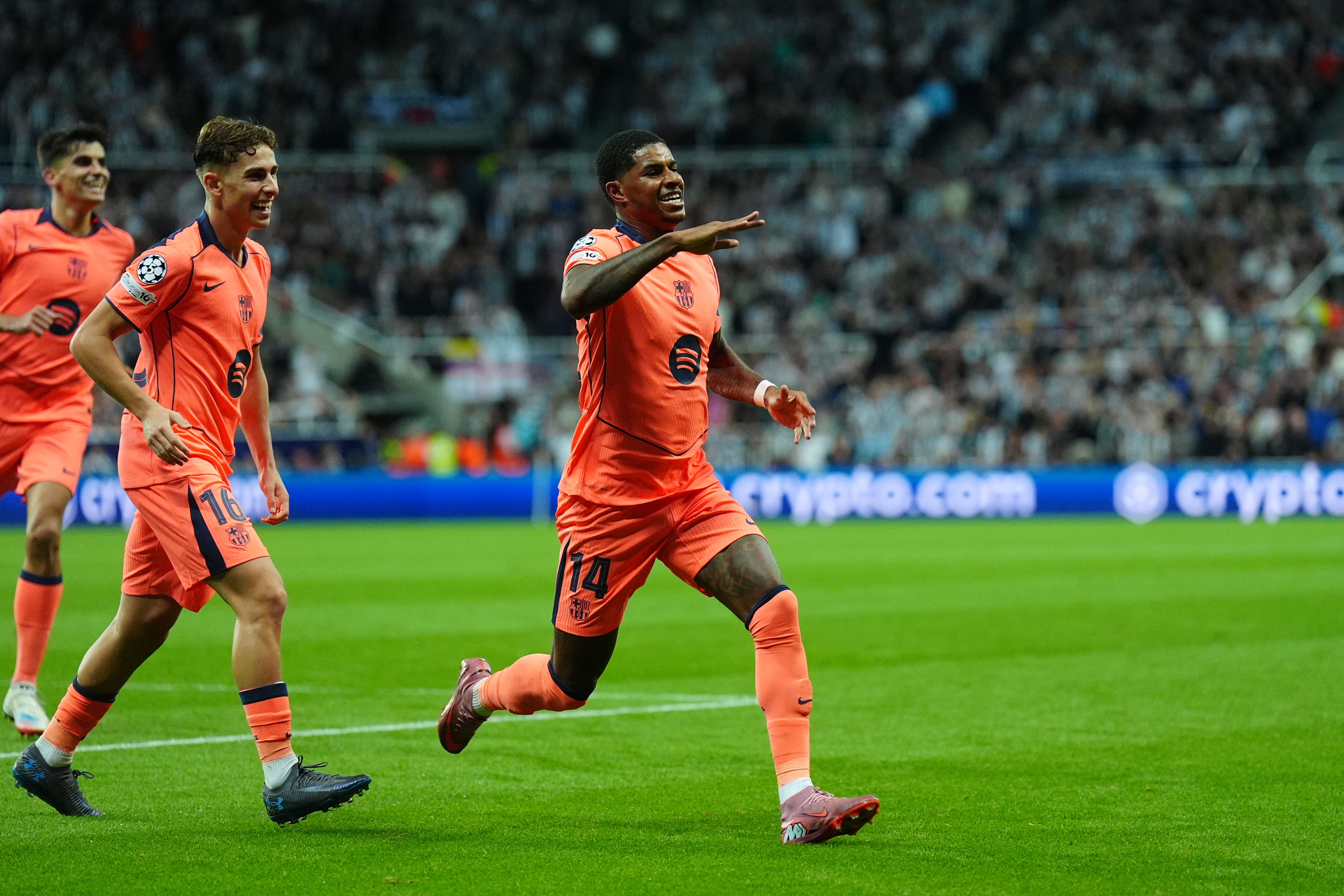 Marcus Rashford celebrates his first goal (Owen Humphreys/PA)