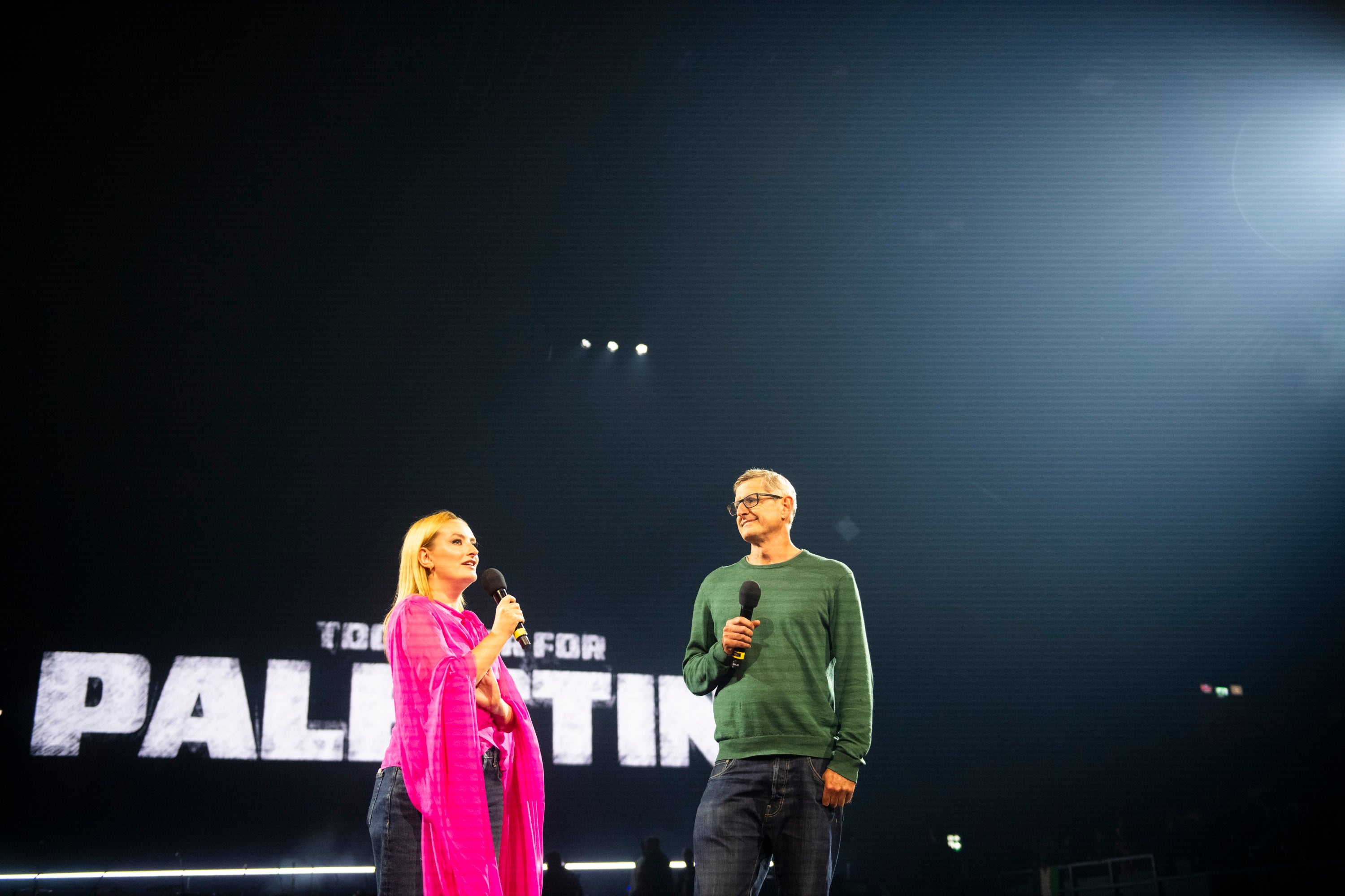 Amelia Dimoldenberg and Louis Theroux on stage at the Together for Palestine fundraiser