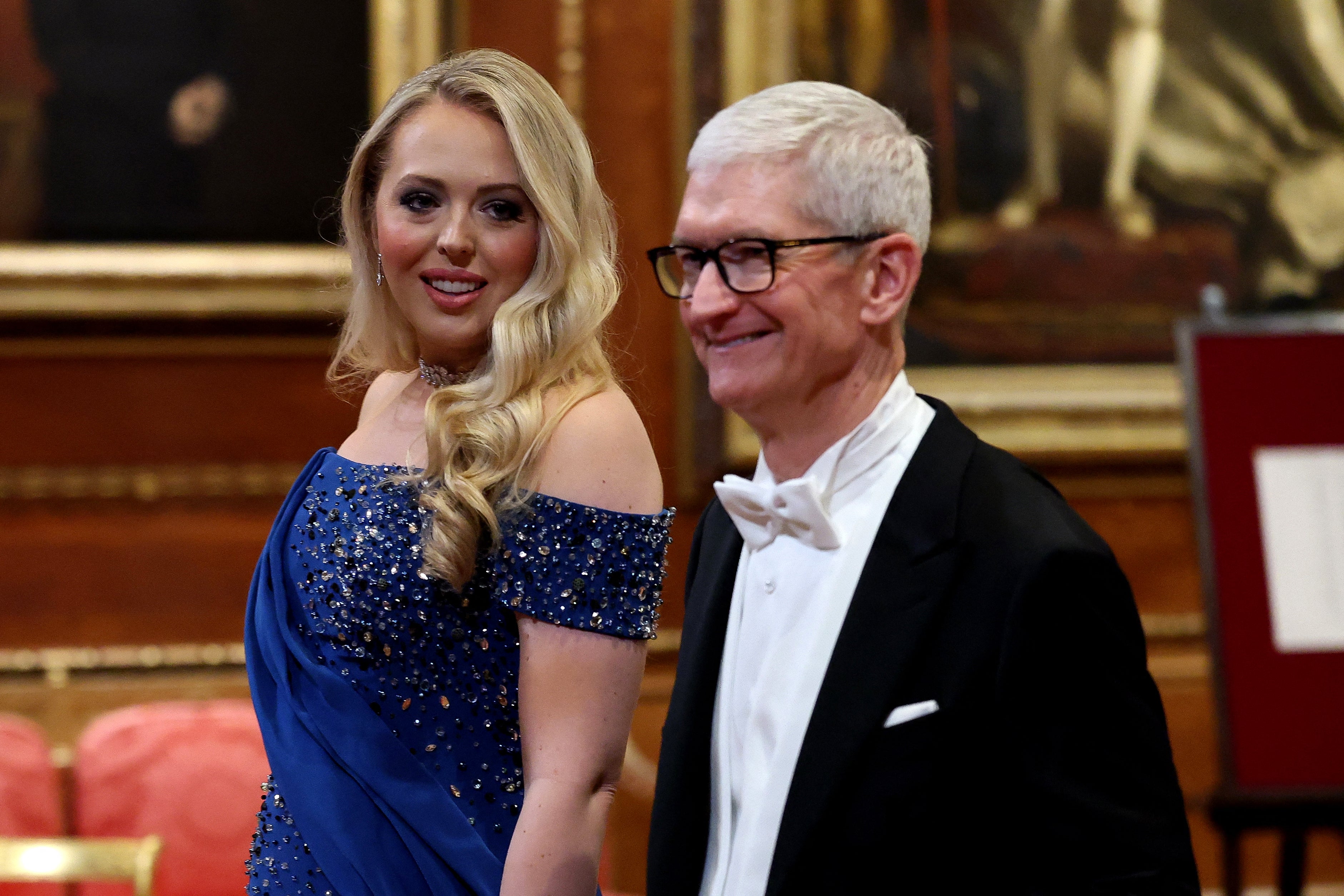 The president’s daughter Tiffany Trump arrives with Apple CEO Tim Cook at the state banquet at Windsor