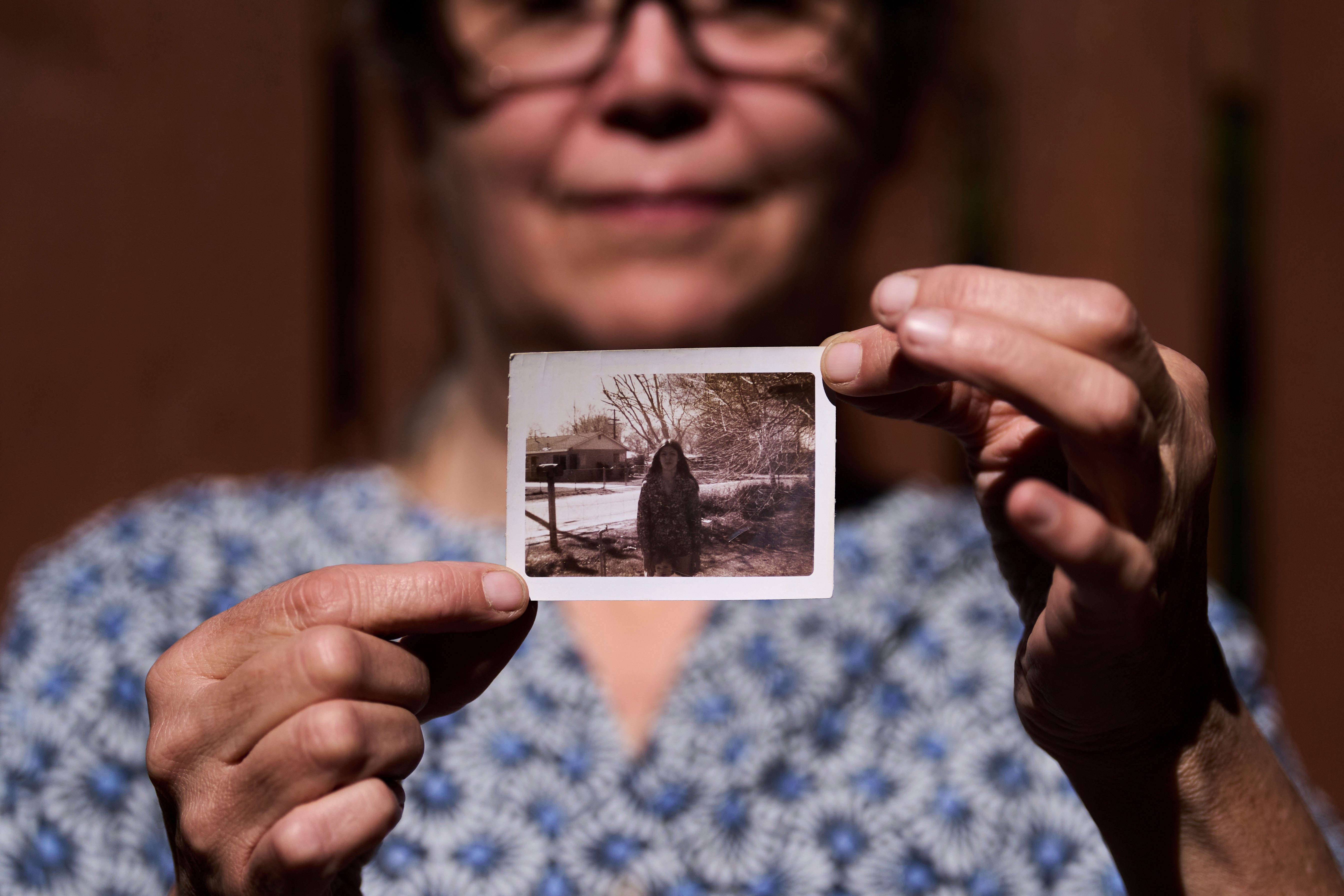 Valerie Nagle, whose DNA recently helped to confirm the remains of her sister Marion Vinetta Nagle McWhorter, who disappeared in 1974 in Oregon, poses for a portrait with a photo of her sister Thursday, Sept. 18, 2025, in Seattle. (AP Photo/Lindsey Wasson)