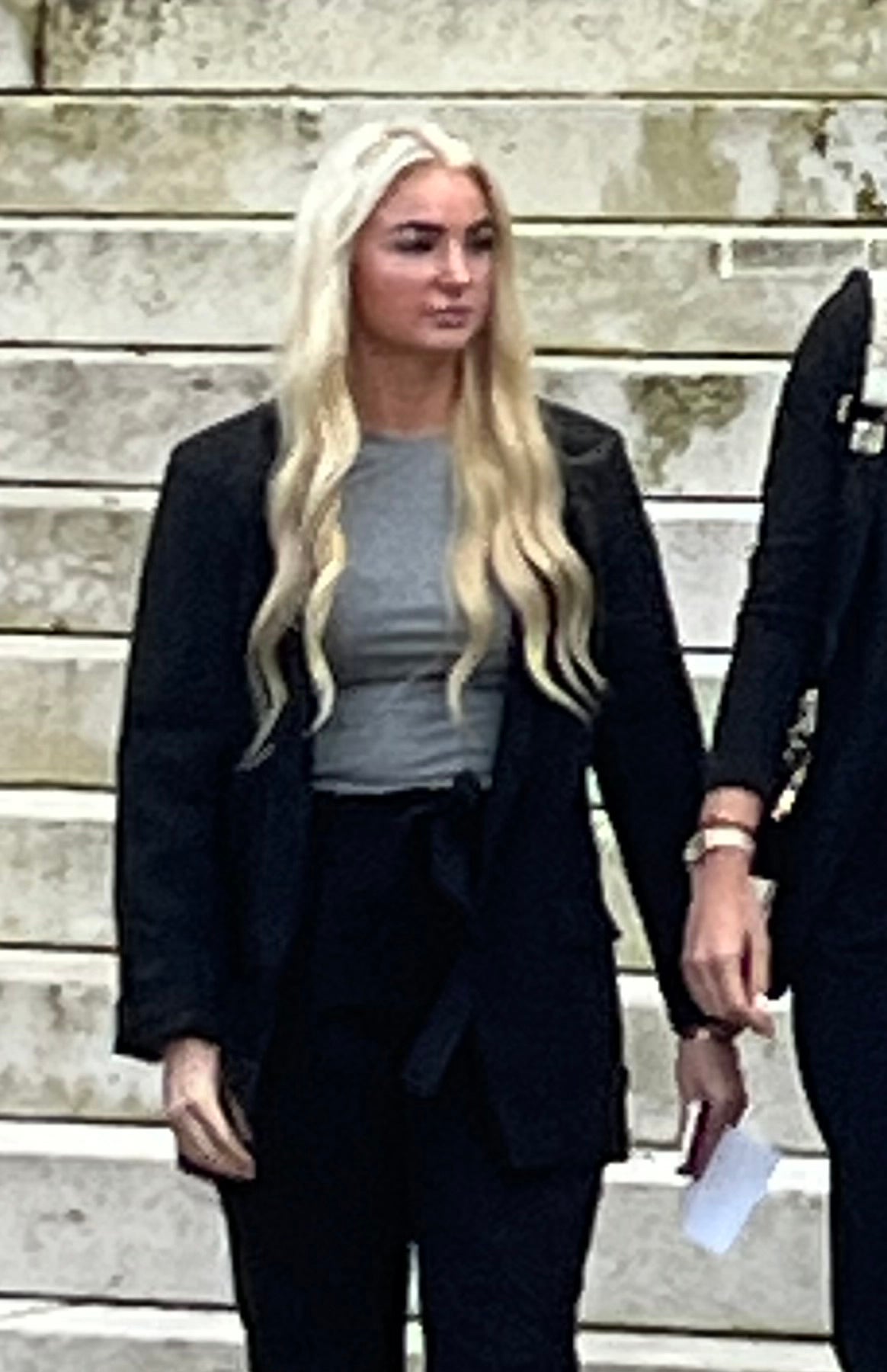 Former prison worker Megan Breen leaves Cardiff Crown Court after receiving a suspended prison sentence for admitting misconduct in public office after forming a relationship with a prisoner at HMP Prescoed, a category D open prison, in Gwent, while working there as an operational support grade worker