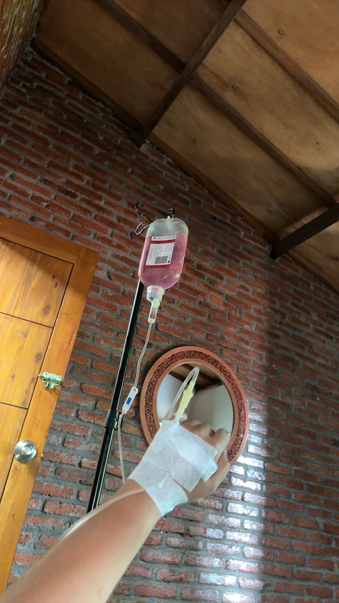 Alysha Pyrgotis pictured on an IV drip on the Island after being diagnosed with typhoid