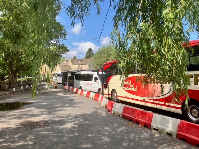 The village’s coach car park has been closed with designated drop-off points as part of a trial set up to combat congestion. Picture taken in June