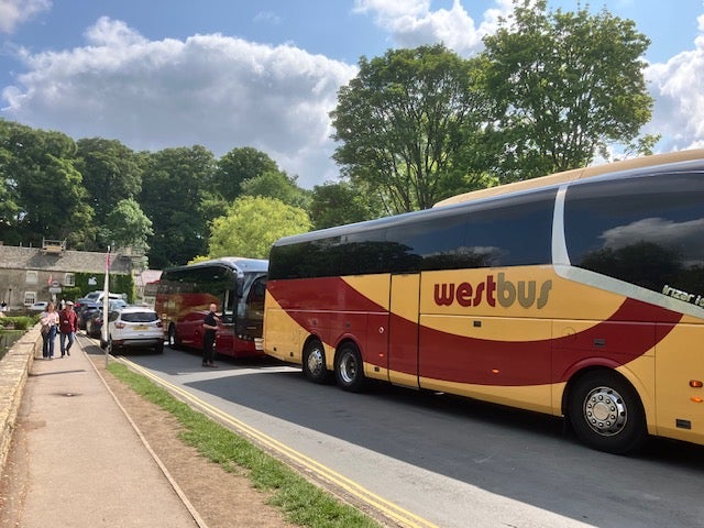 Coaches fill the main road through Bibury on a busy day for the village in June. Parish council chairman Craig Chapman wants a ban on coaches