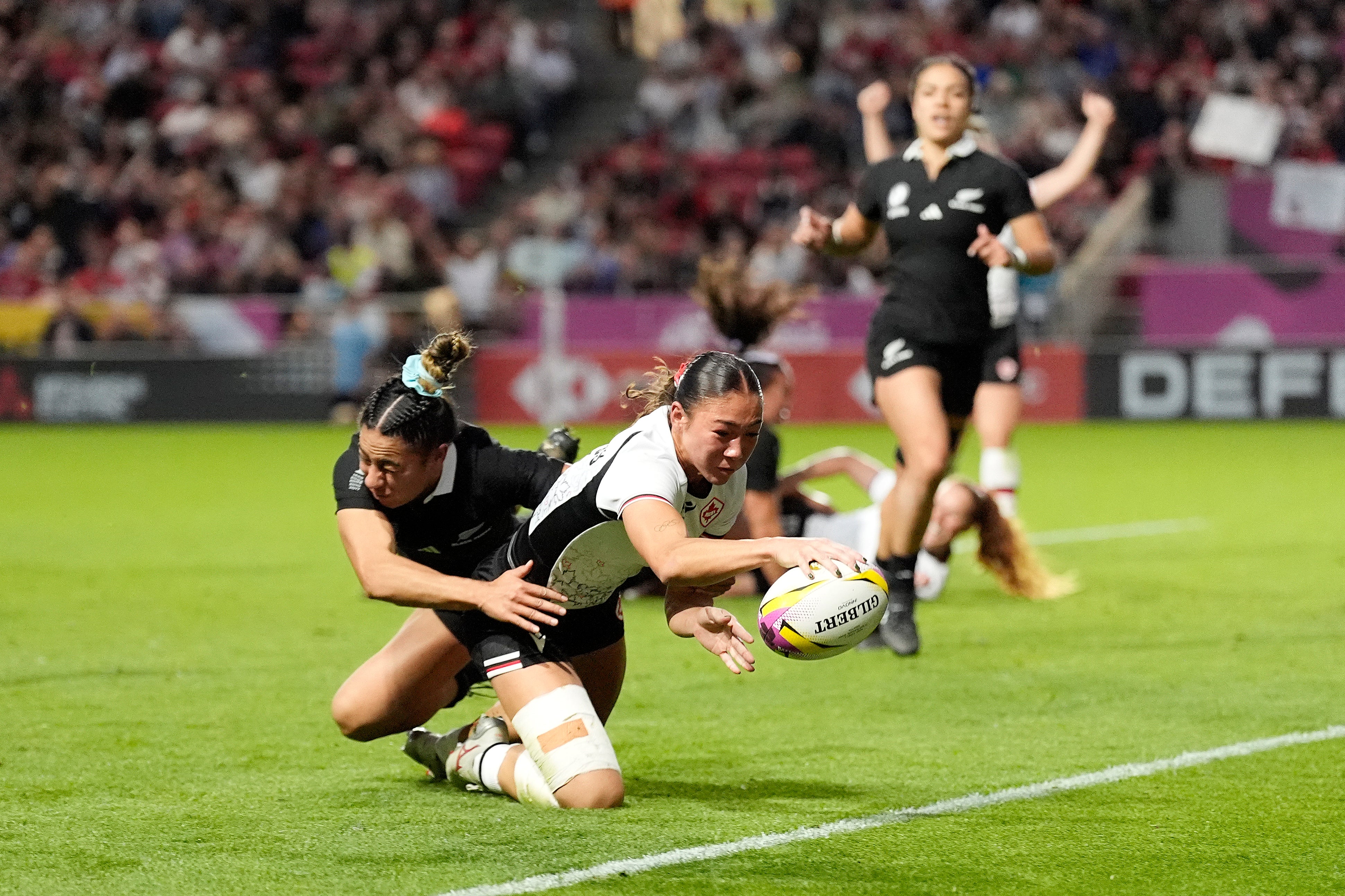 Canada's Florence Symonds scored their third try against New Zealand