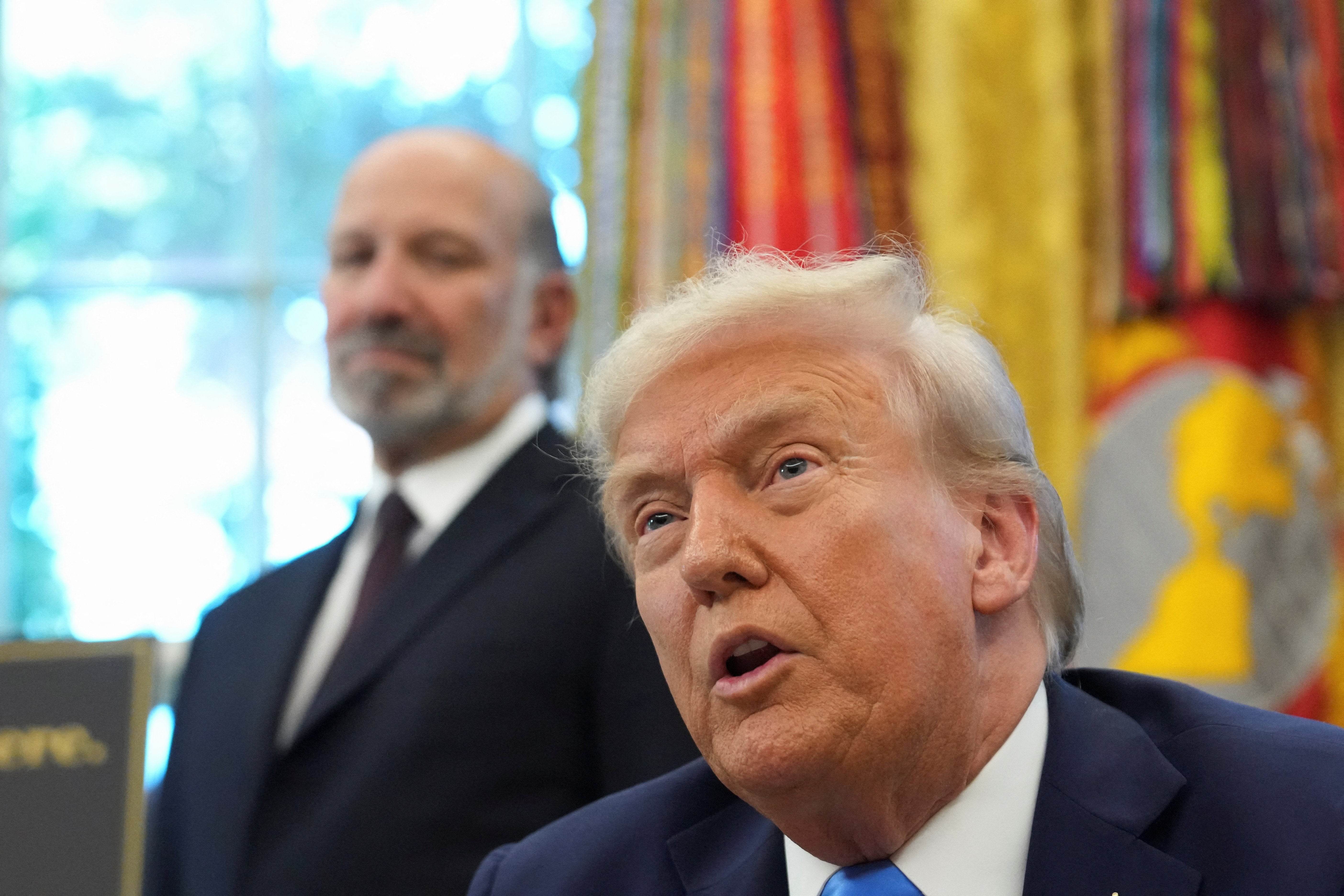 President Donald Trump and Commerce Secretary Howard Lutnick announced the visa scheme overhaul at the White House on Friday
