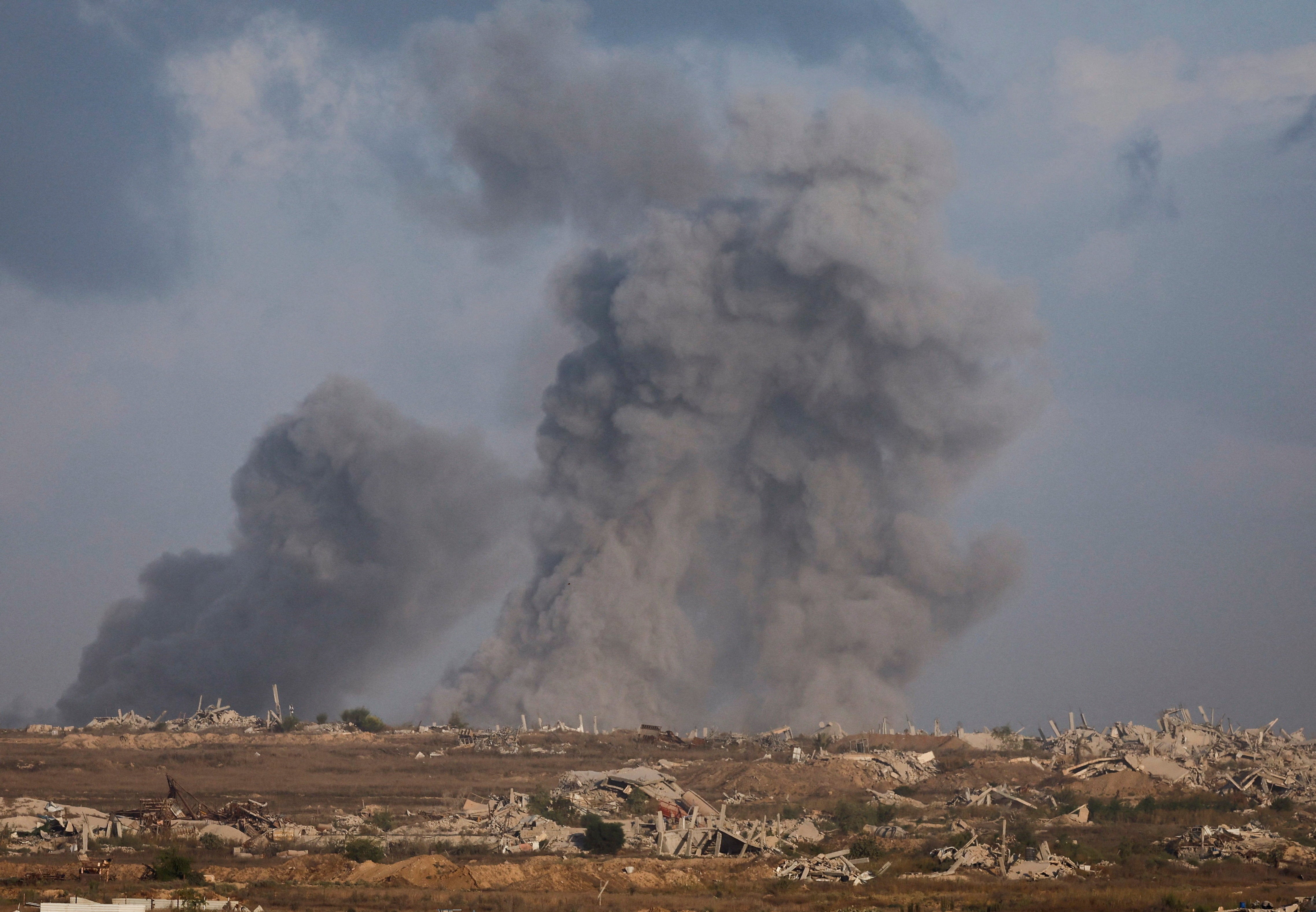 Smoke rises from Gaza after an explosion, as seen from Israel on Friday